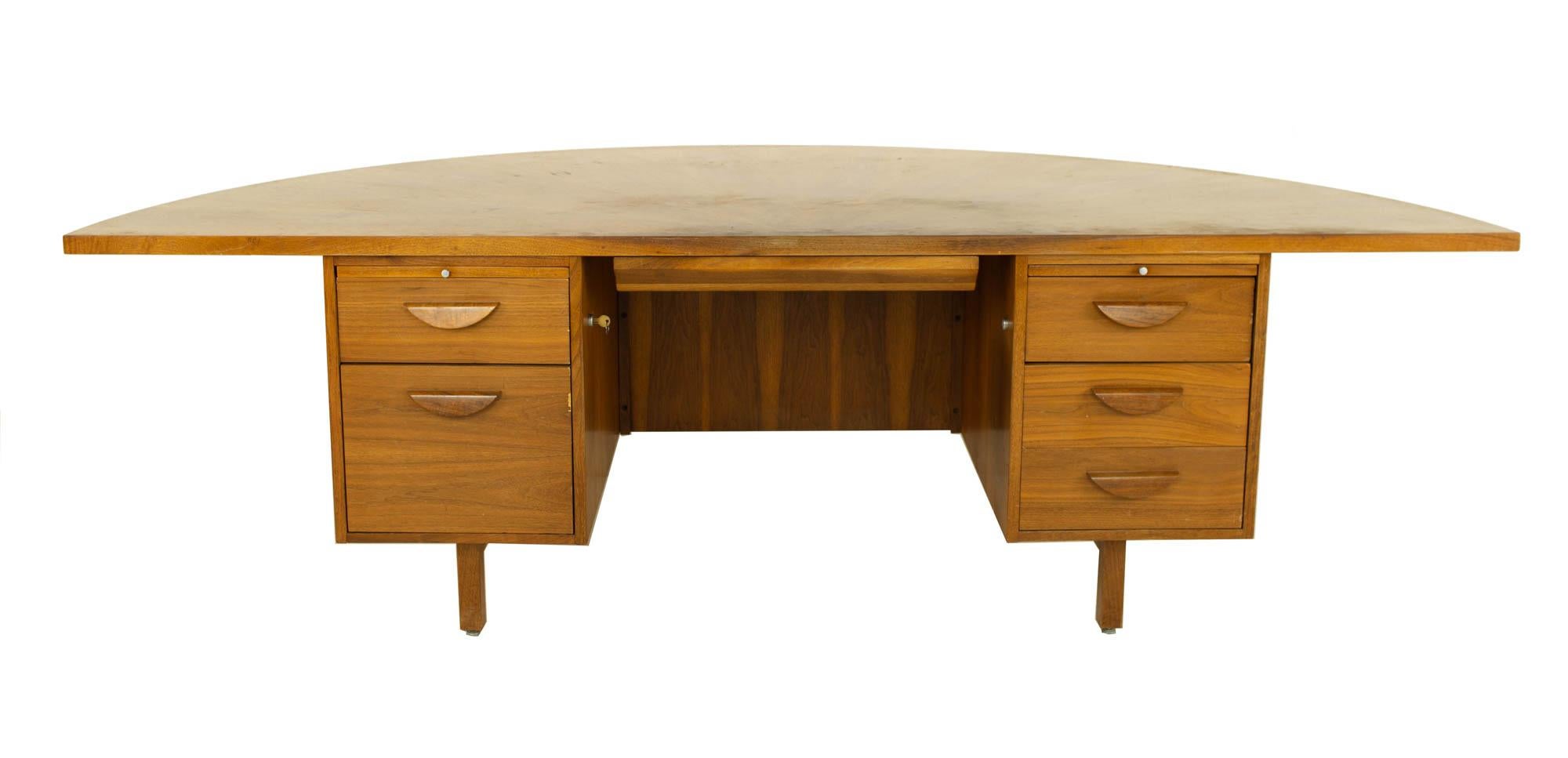 Jens Risom style mid century half round walnut executive desk

Desk measures: 95.5 wide x 48 deep x 29.5 inches high 

?All pieces of furniture can be had in what we call restored vintage condition. That means the piece is restored upon purchase
