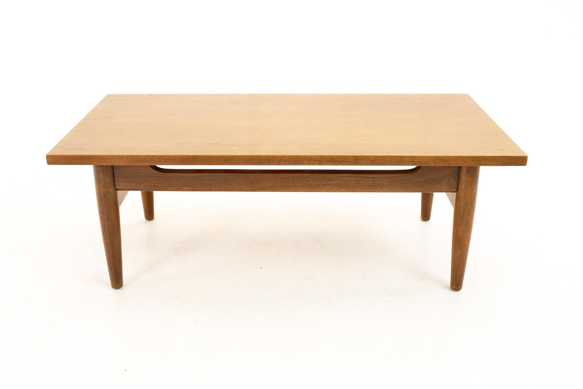 Jens Risom Style midcentury walnut coffee table
Table measures: 36 wide x 18.75 deep x 13 high

All pieces of furniture can be had in what we call restored vintage condition. This means the piece is restored upon purchase so it’s free of