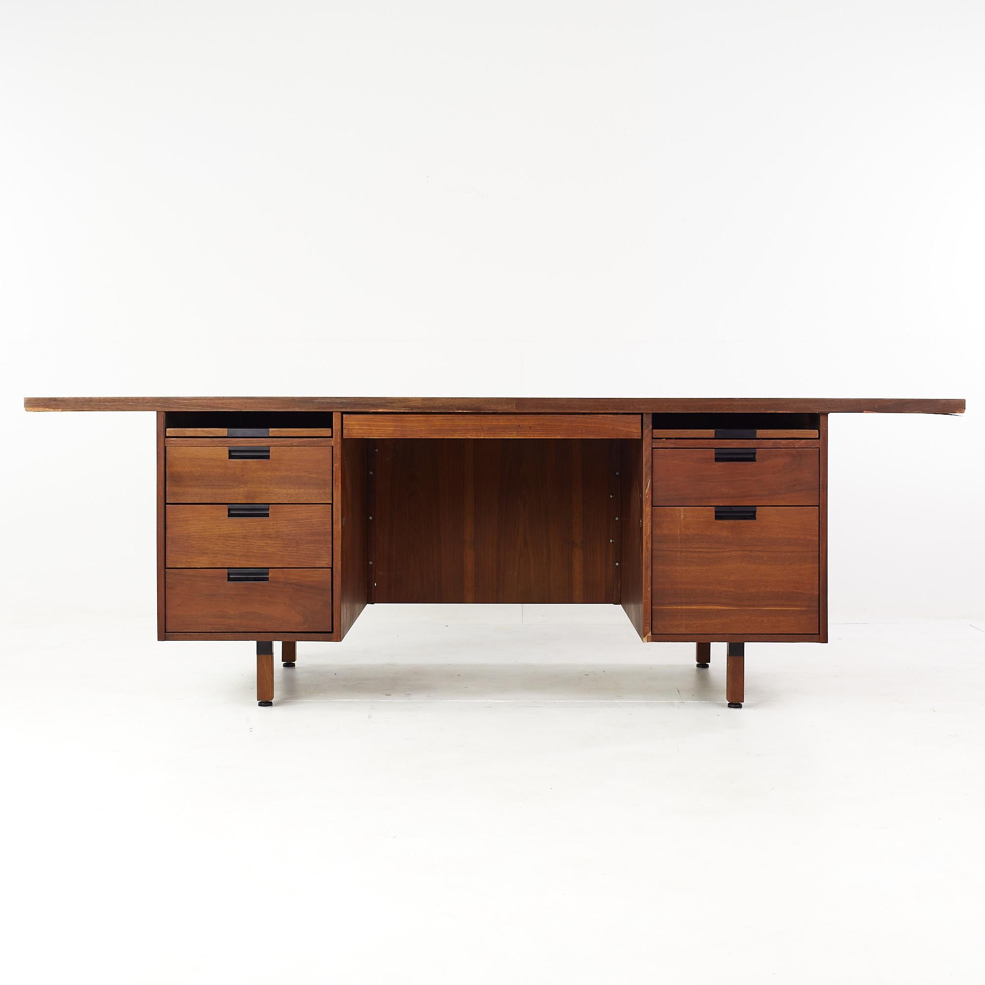 Jens Risom style mid century walnut semi circle executive desk.

This desk measures: 88 wide x 44 deep x 30 high, with a chair clearance of 28 inches.

All pieces of furniture can be had in what we call restored vintage condition. That means the
