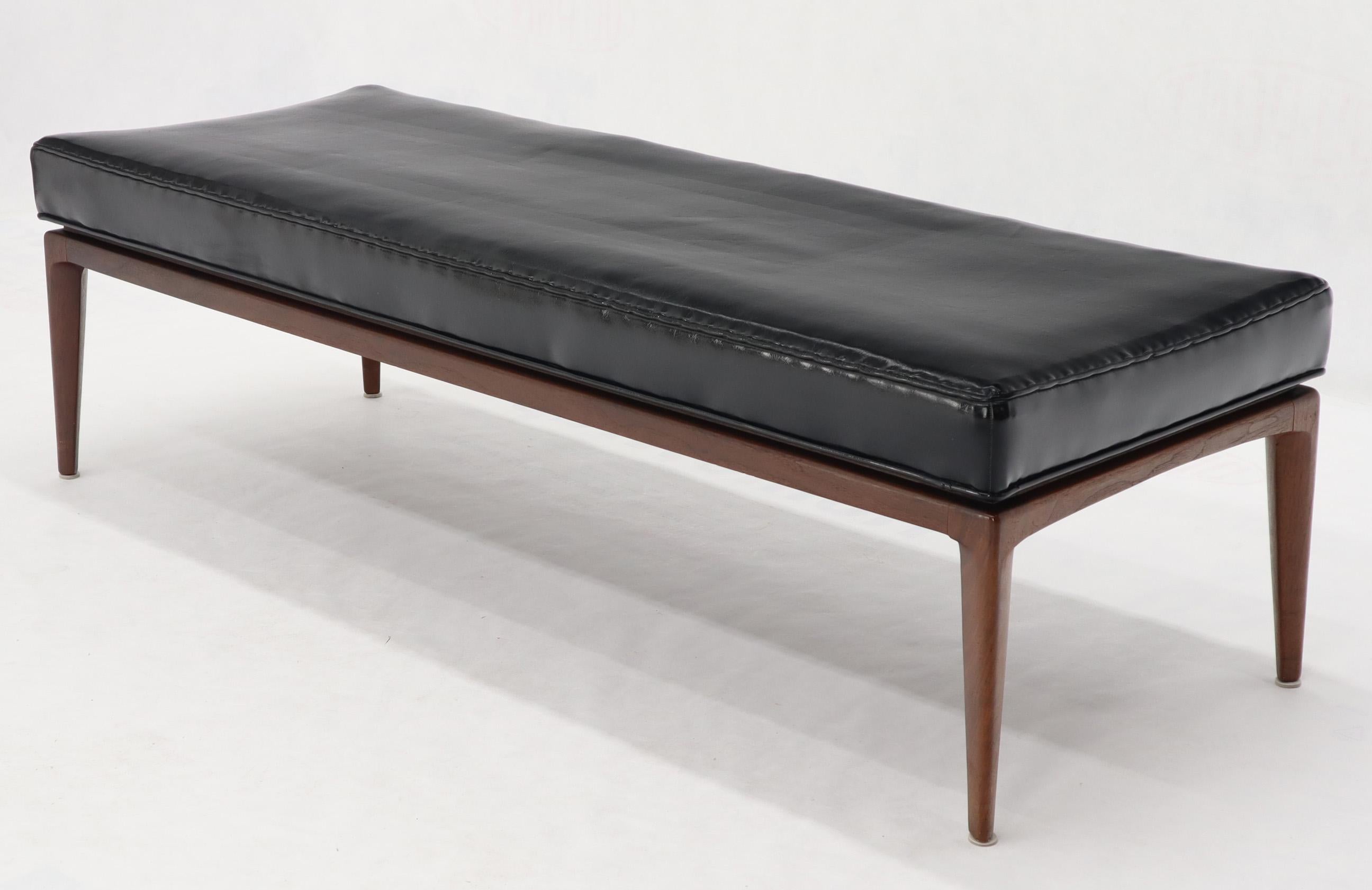 Oiled walnut base Mid-Century Modern black vinyl upholstery bench in style of Jens Risom.