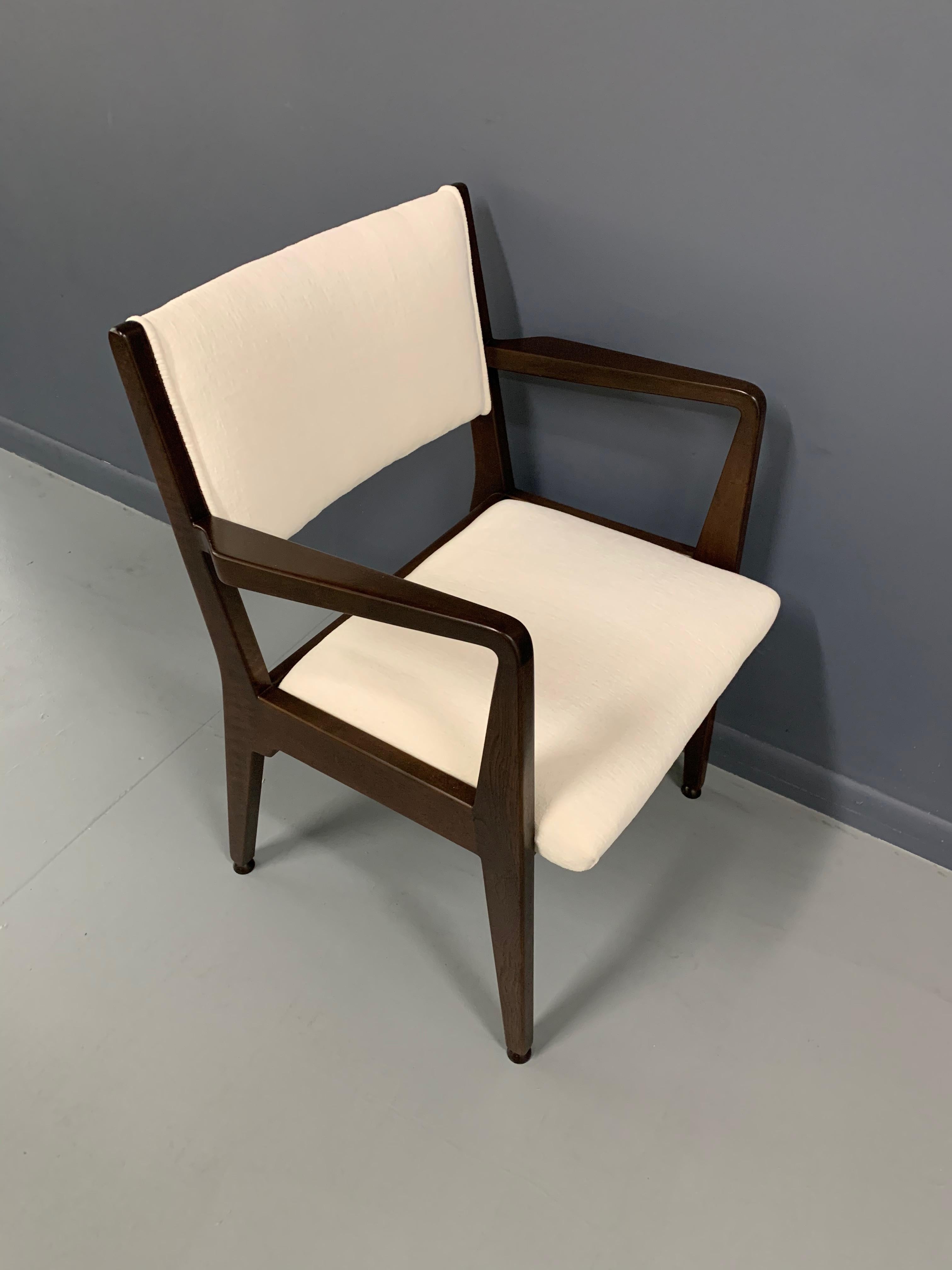 Beautifully restored walnut armchair that has been lovingly restored with a deep walnut color stain and upholstered in a nice textured white velvet.