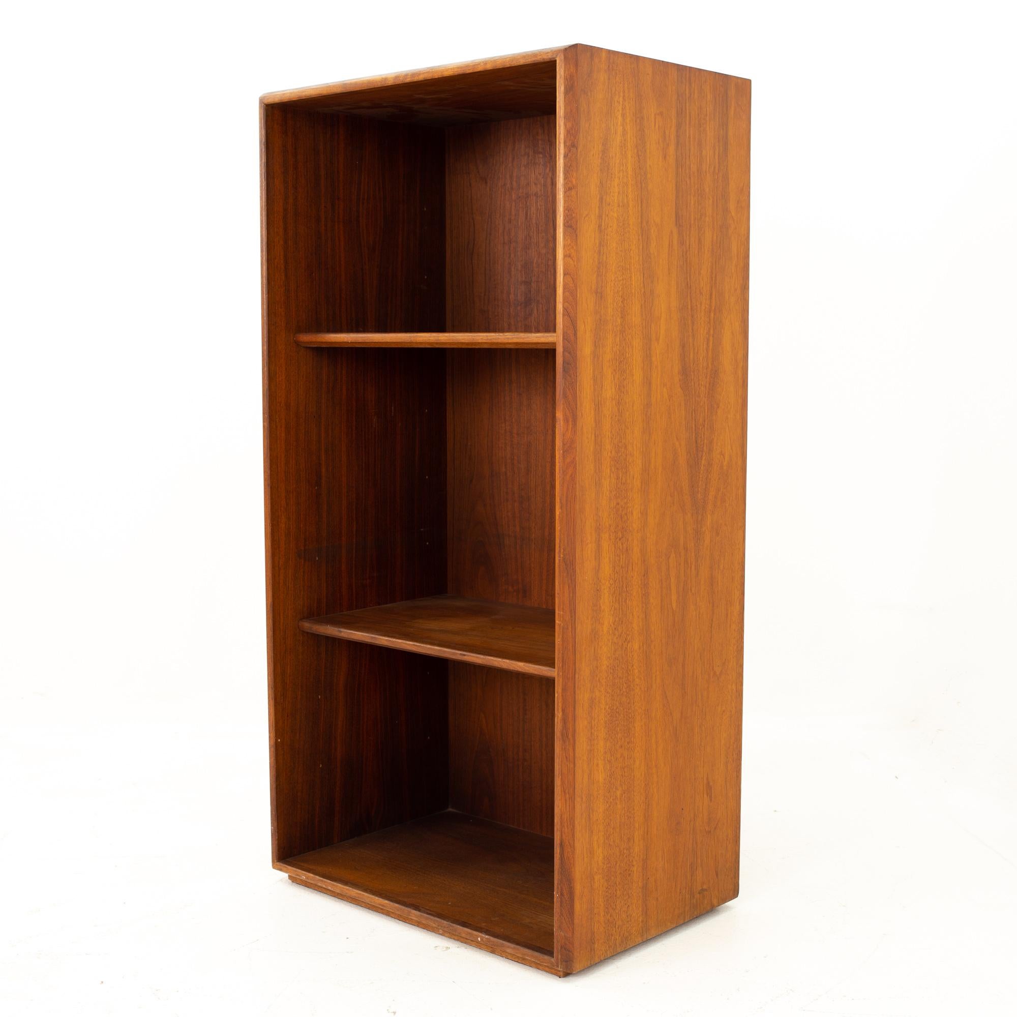 Jens Risom walnut bookcase shelving
Bookcase measures: 22.5 wide x 15 deep x 44 high

All pieces of furniture can be had in what we call restored vintage condition. That means the piece is restored upon purchase so it’s free of watermarks, chips