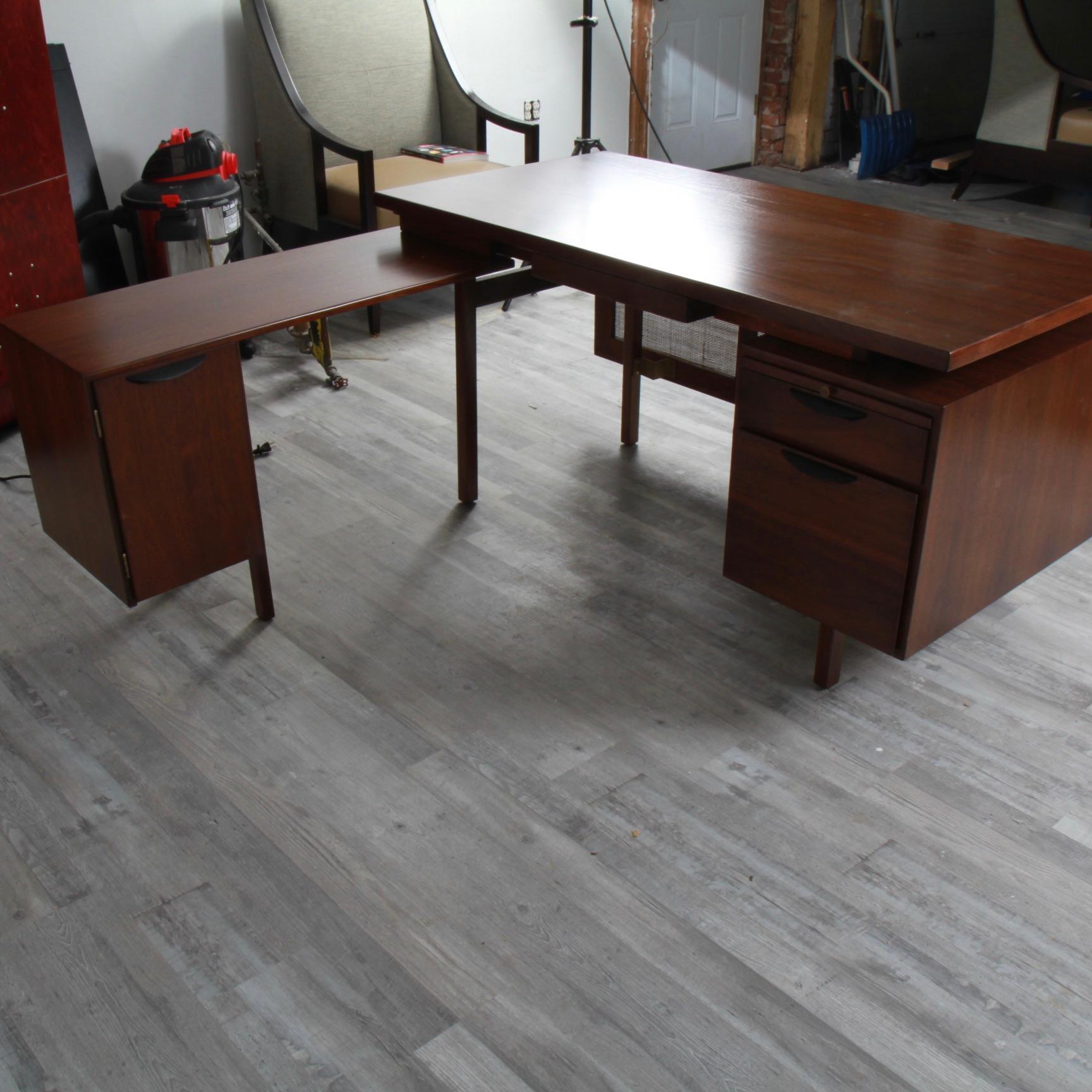 Jens Risom designed a nice variety of desks over the years, but this may be one of the more rare survivors from the sixties. Professionally refinished in its original walnut finish with the cane privacy screen newly re-caned. Shorter return comes