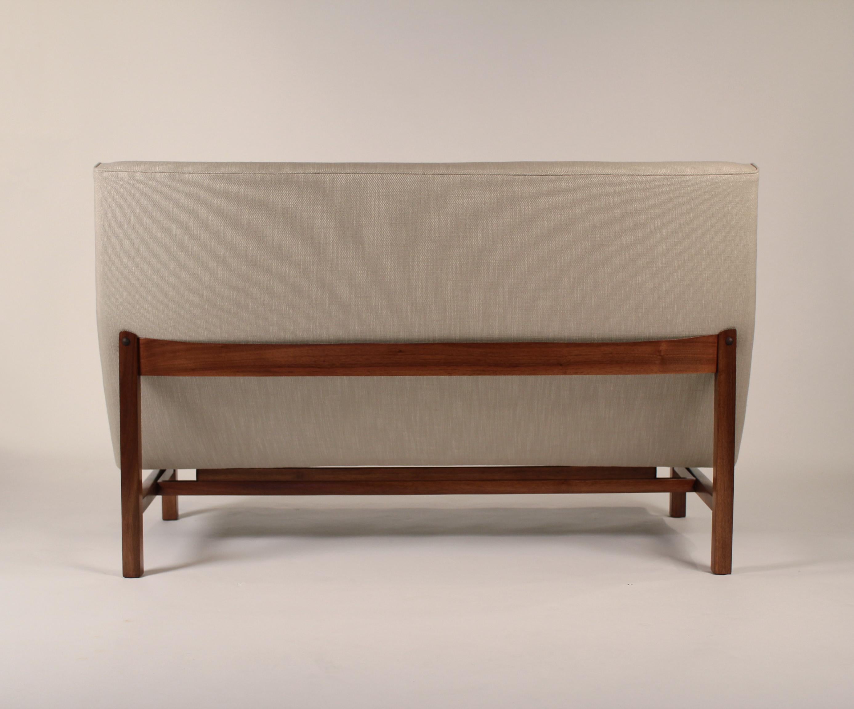 Small sofa designed by Jens Risom from the 1960s fully restored. New perennials upholstery, new foam, frame trued and refinished. An exceptional looking design created with ergonomic comfort in mind.