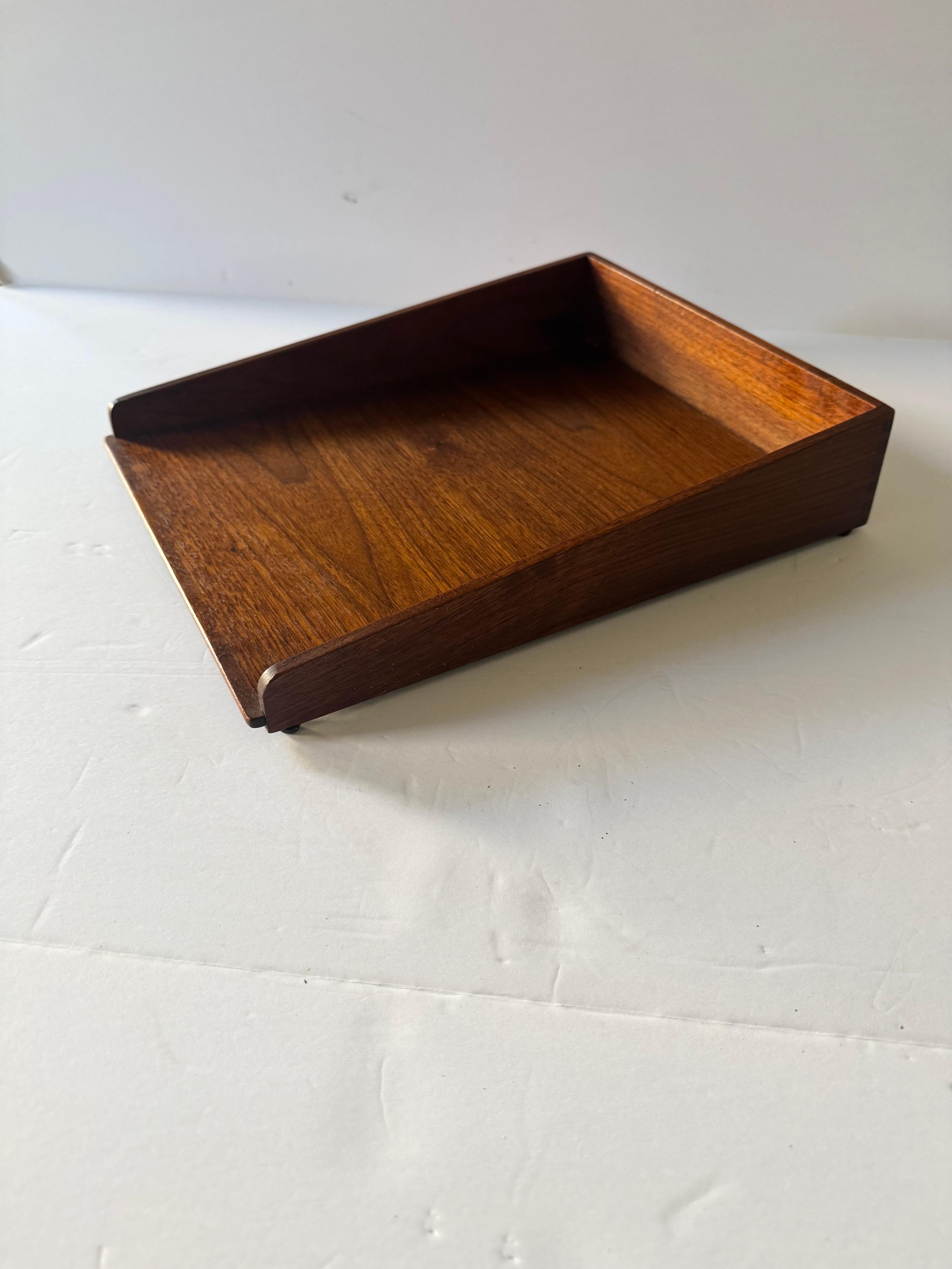 Jens Risom letter tray, model 8-33 by Jens Risom Design Inc.

USA, c. 1960

Walnut.

Metal manufacturer's label to underside; 'Jens Risom Design.’

Literature: Jens Risom Design Inc.: Contemporary Furniture for Business & Residential Interiors,