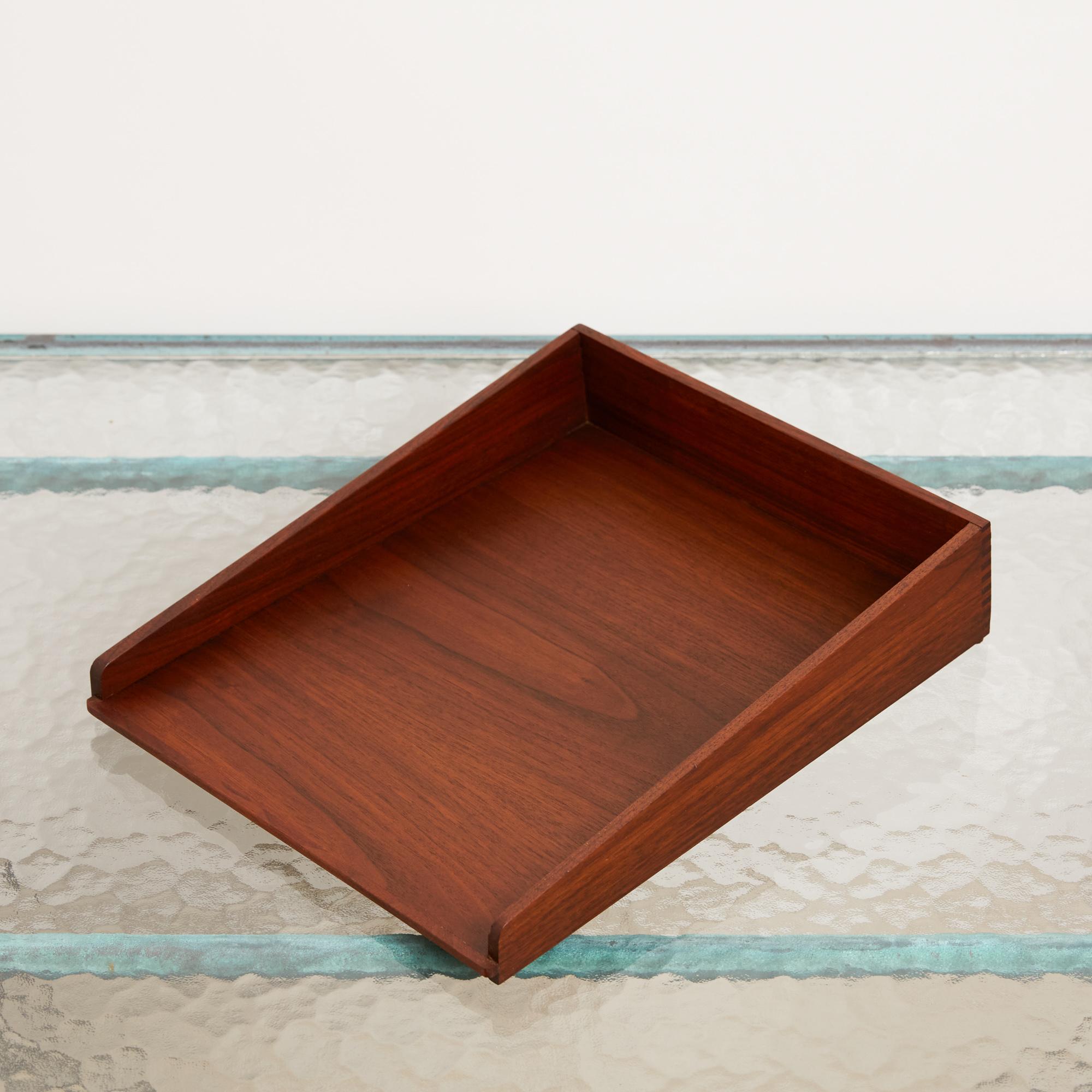 Walnut paper tray by Jens Risom for Risom Design. The tray features oiled walnut angled side panels with a slanted bed and finger joinery.

There are four trays available and they are priced individually.

Dimensions: 11