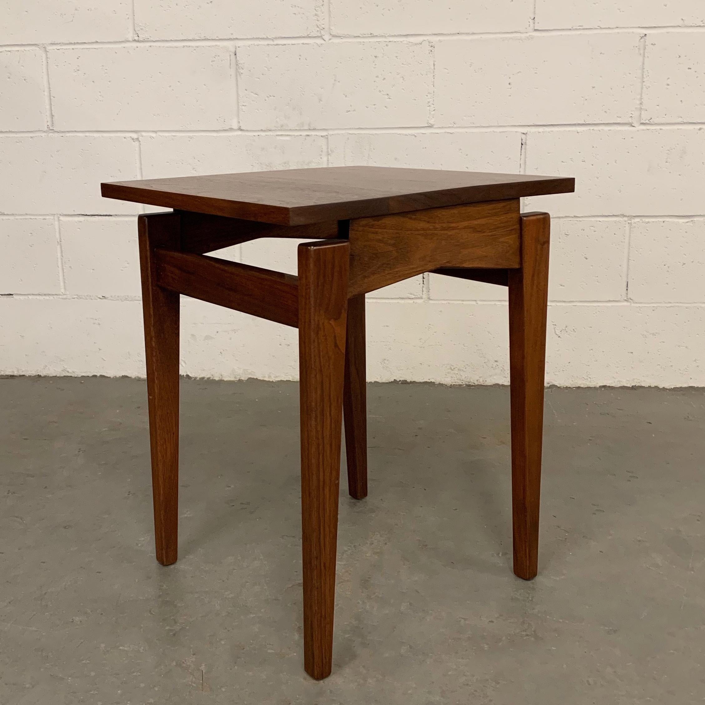 Mid-Century Modern, walnut, side table by Jens Risom features a sculptural base with floating top.