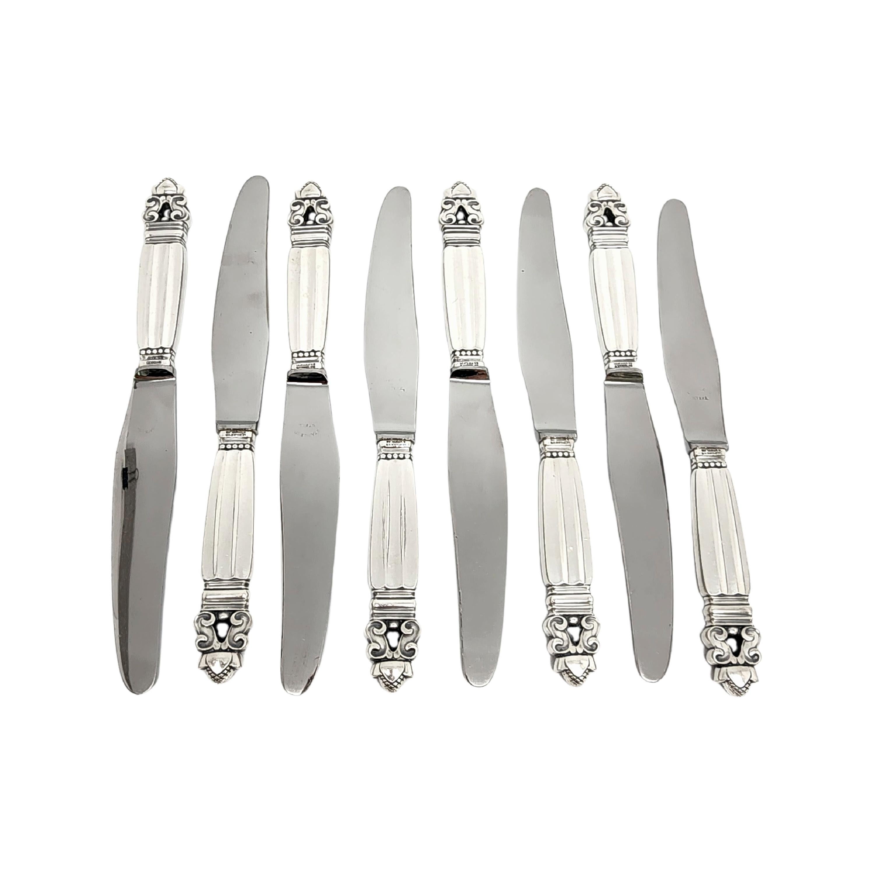 Set of 8 sterling silver handle stainless blade knives in the Acorn pattern by Georg Jensen.

The Acorn pattern was introduced in 1915 as a collaboration between Georg Jensen and designer Johan Ronde. The Acorn pattern, which combines Art Nouveau