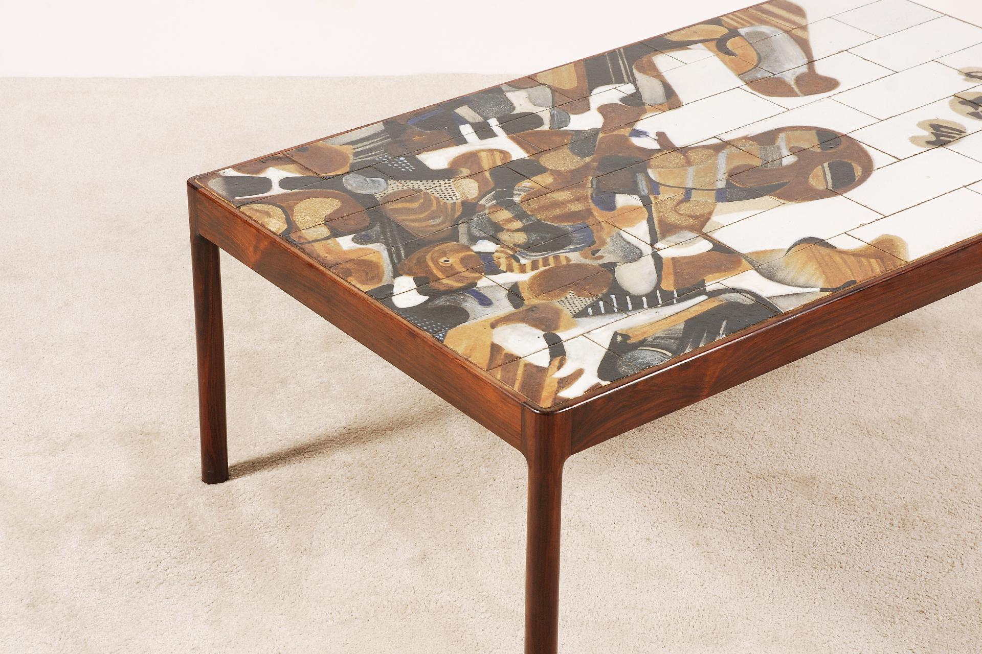 Large coffee table designed by the Danish artist Jeppe Hagedorn-Olsen, circa 1960.
The top is made of ceramic tiles and the frame is in rosewood.
Excellent condition.