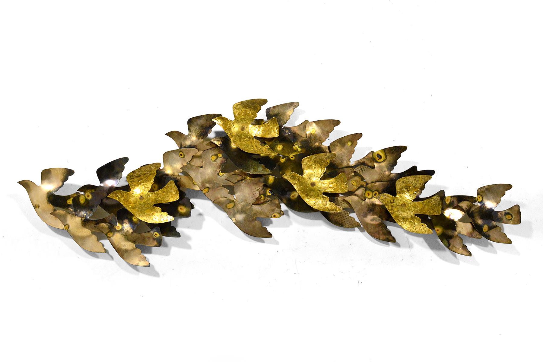This large, and uncommon C. Jere wall sculpture is a wonderful abstract composition of stylized doves with delightful variegated surface treatments. It retains its original Artisan House tag with the title, 