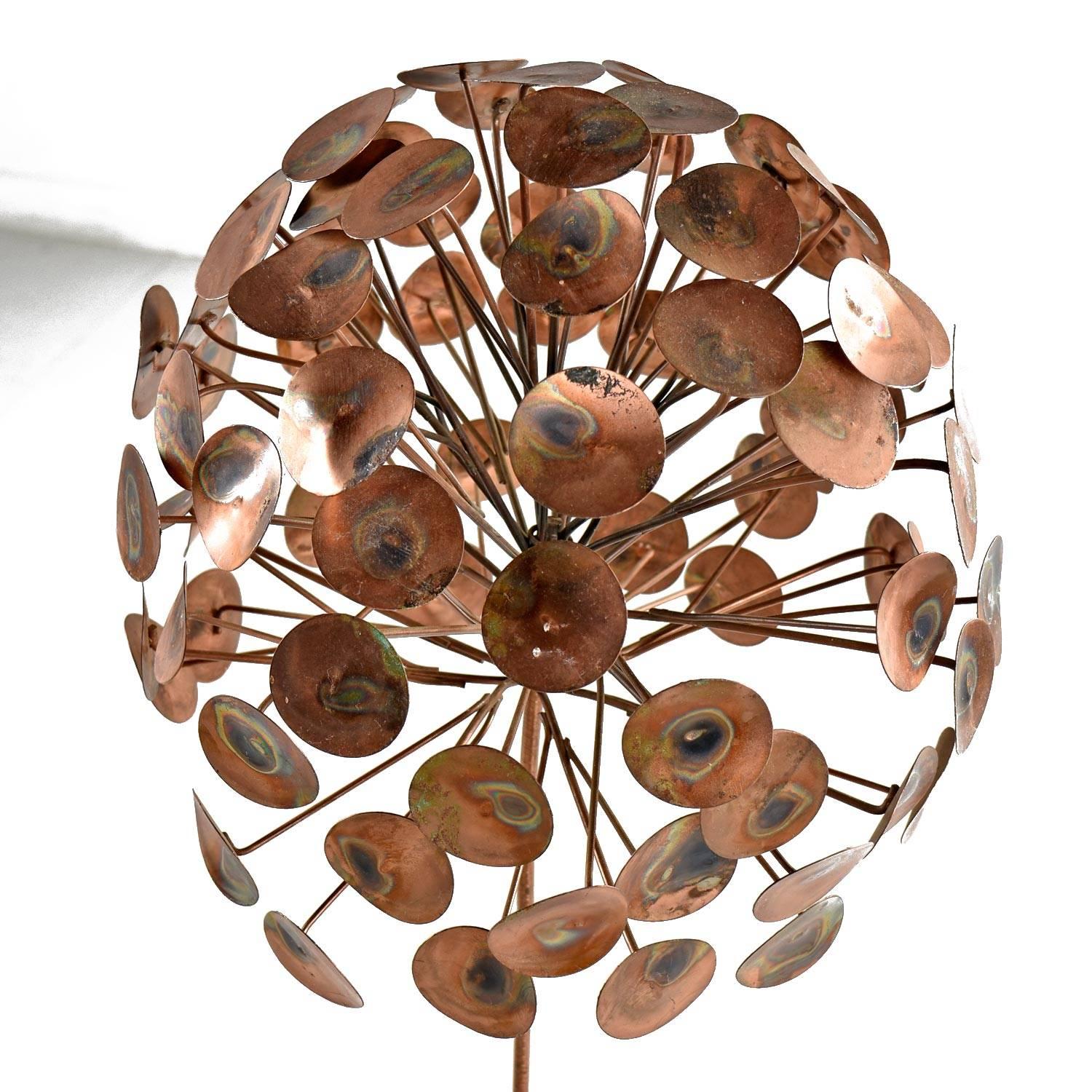 This copper colored metal tree is populated with a bountiful plume of leaves, each individually sculpted and welded to their respective branch. The stunning work of art is created from a brass copper colored metal alloy. The decades of patina add an