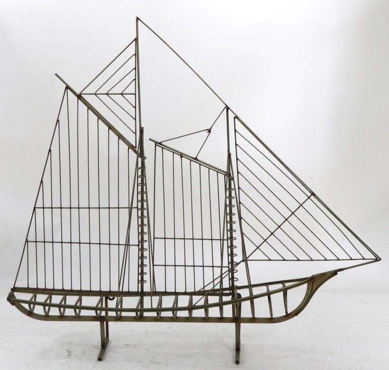 Large and impressive sailboat model by Jere, signed and dated ( Jere 1976 ). This example can be displayed as a freestanding objet, or can be mounted on a wall if you prefer.
It is in very fine, original, clean and ready to use condition. 
Hard to