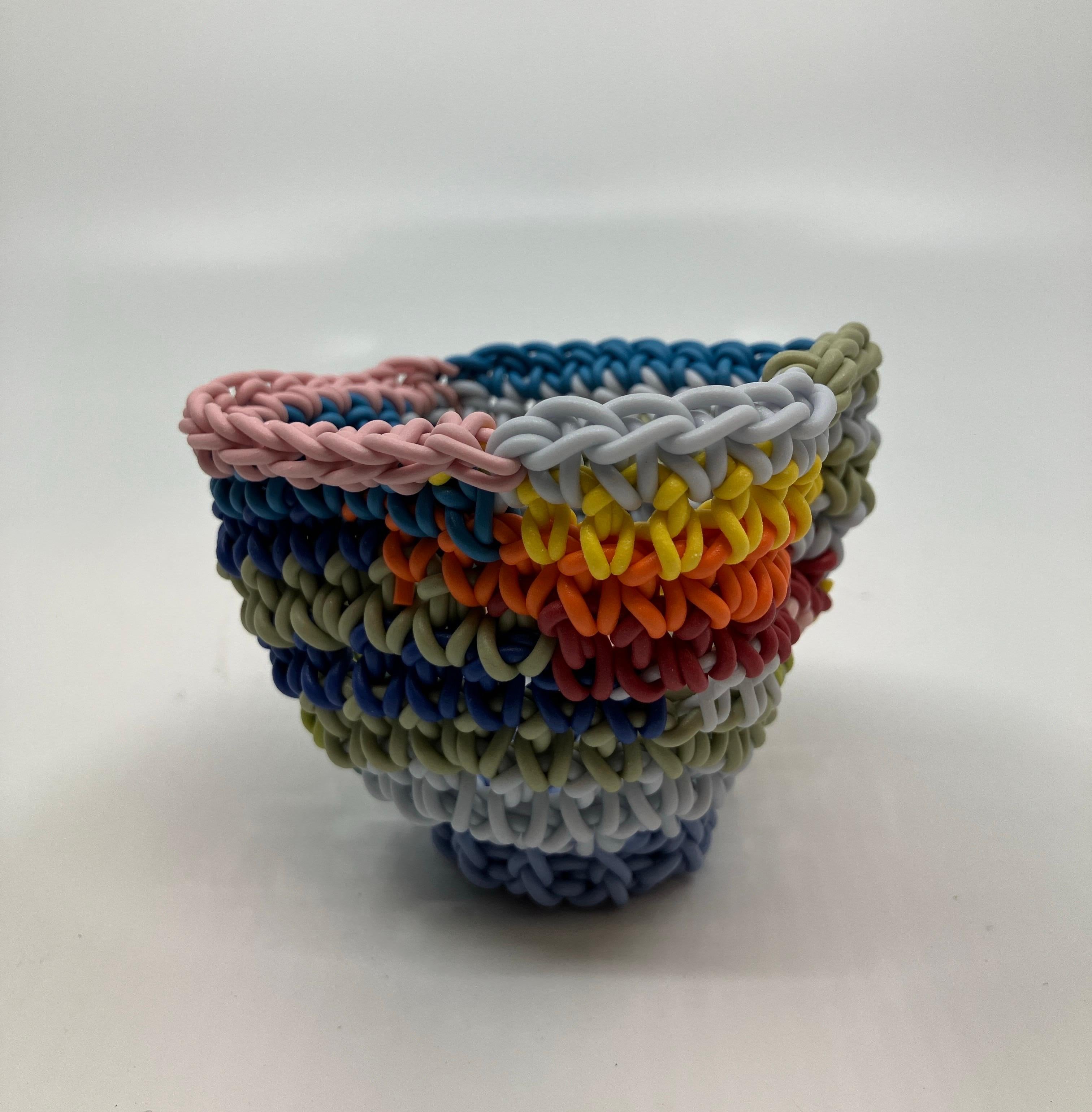 Hand Crocheted Ceramic Sculpture, Colored Porcelain, Tea Cup, Multicolored

Jeremy R. Brooks was born in Detroit, MI in 1979. He received his BFA from Grand Valley State University & MFA from Alfred University. Jeremy has balanced his career between