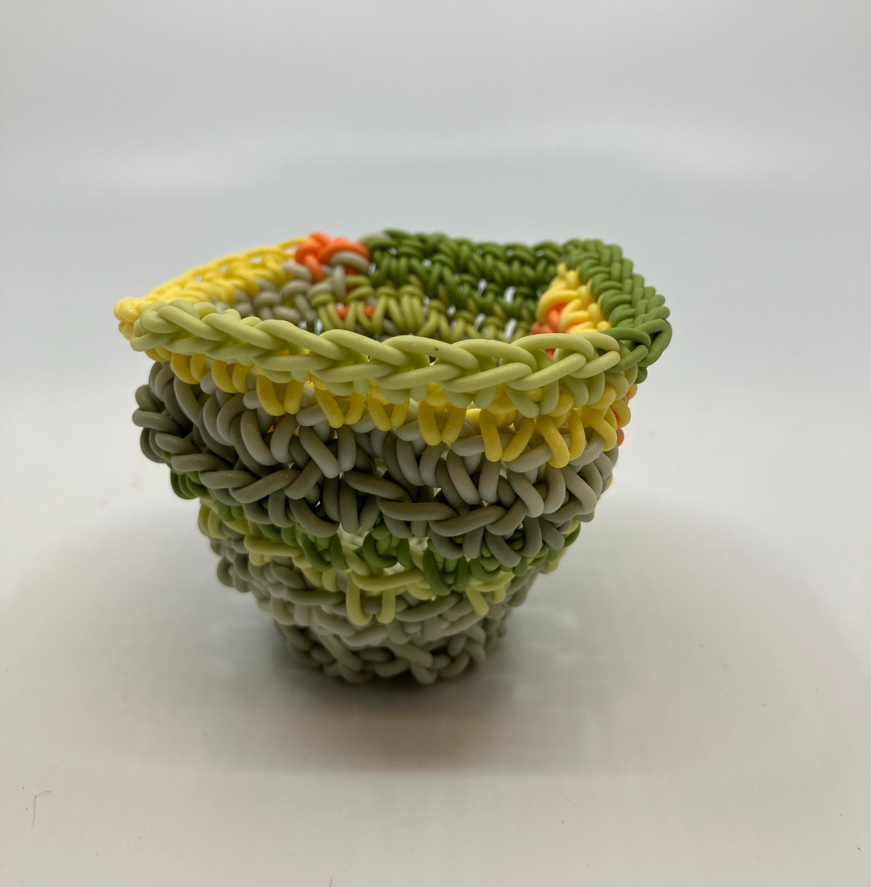 Hand Crocheted Ceramic Sculpture, Colored Porcelain, Tea Cup, Multicolored

Jeremy R. Brooks was born in Detroit, MI in 1979. He received his BFA from Grand Valley State University & MFA from Alfred University. Jeremy has balanced his career between