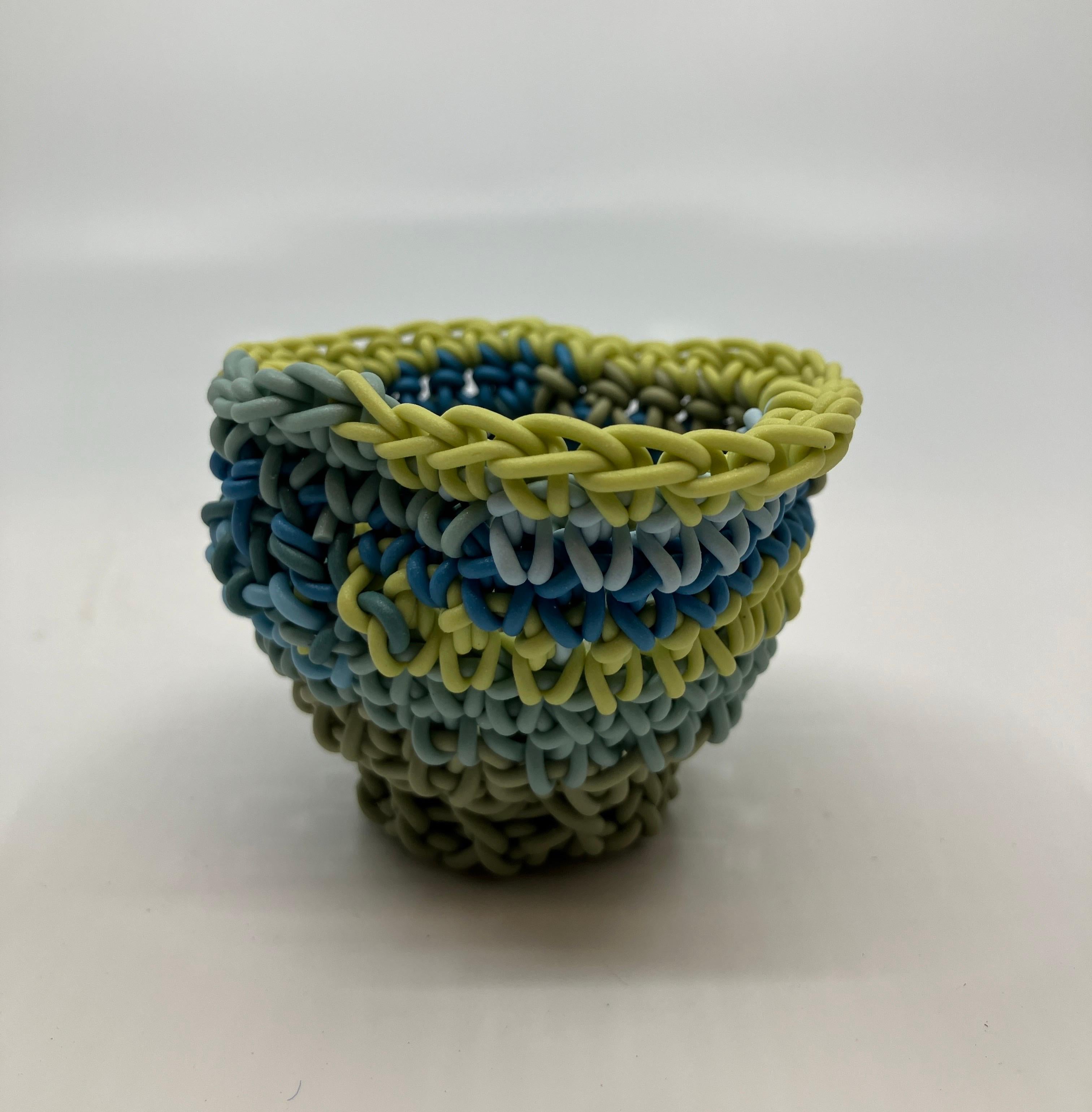 Hand Crocheted Ceramic Sculpture, Colored Porcelain, Tea Cup, Multicolored

Jeremy R. Brooks was born in Detroit, MI in 1979. He received his BFA from Grand Valley State University & MFA from Alfred University. Jeremy has balanced his career between