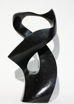 Embrace 1/50 - small, smooth, polished, abstract, black granite sculpture