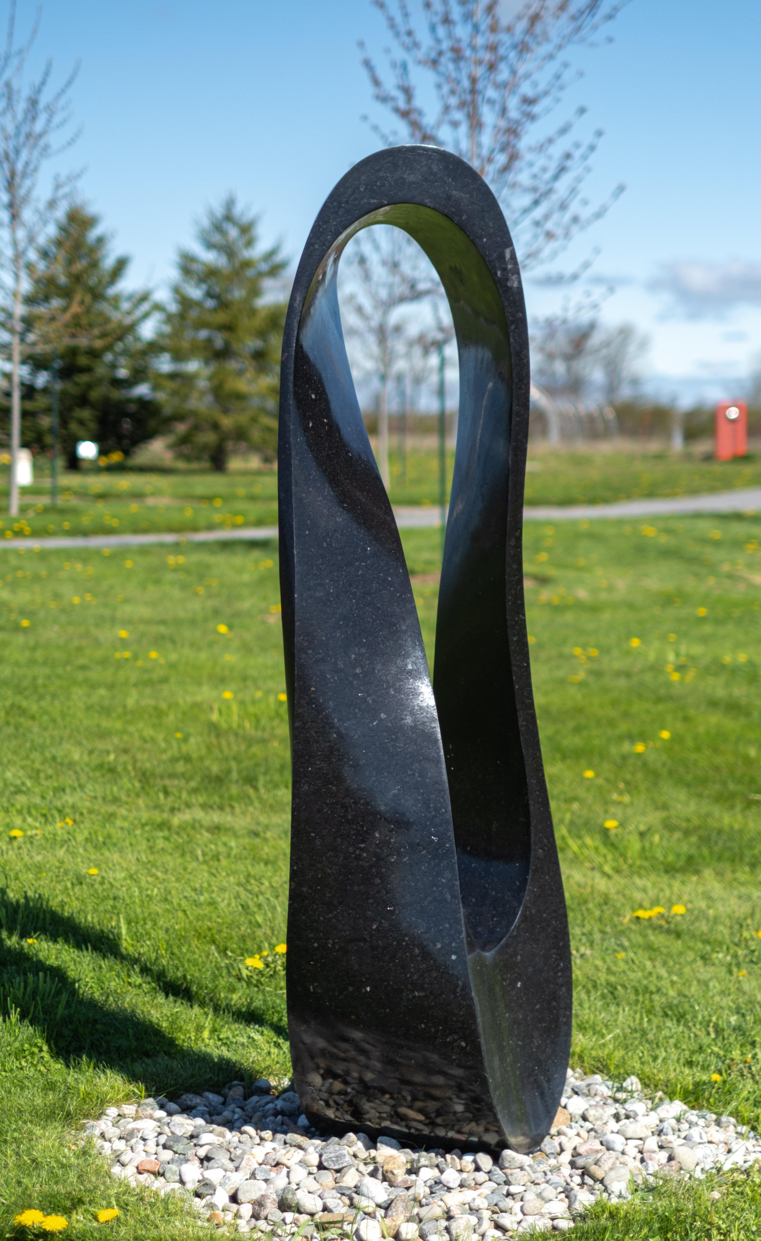 Mobius H6 25/50 - large, smooth, black granite, abstract, outdoor sculpture