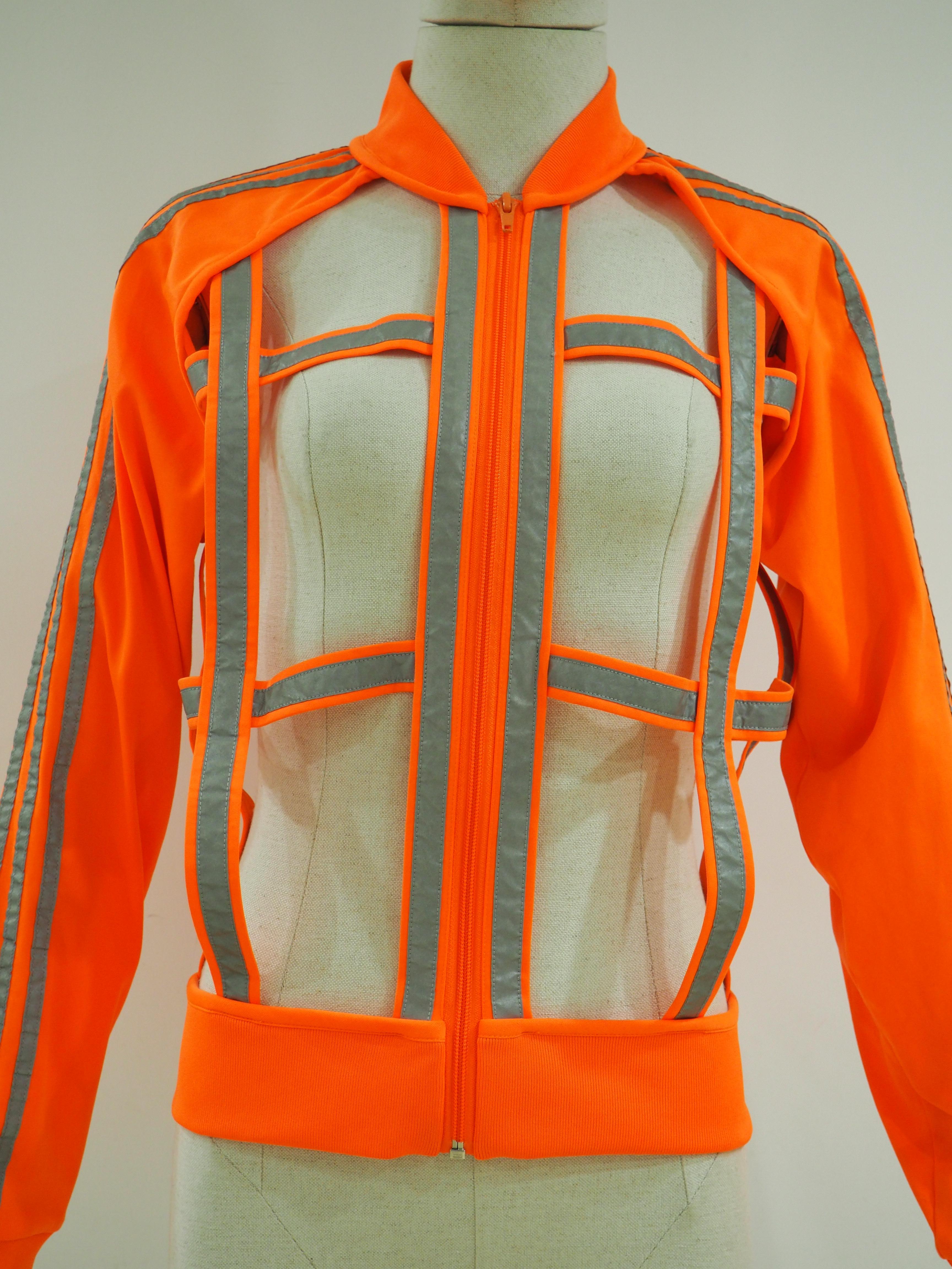 Jeremy Scott Adidas orange see through jacket
Fluo orange and silver jacket
size M
