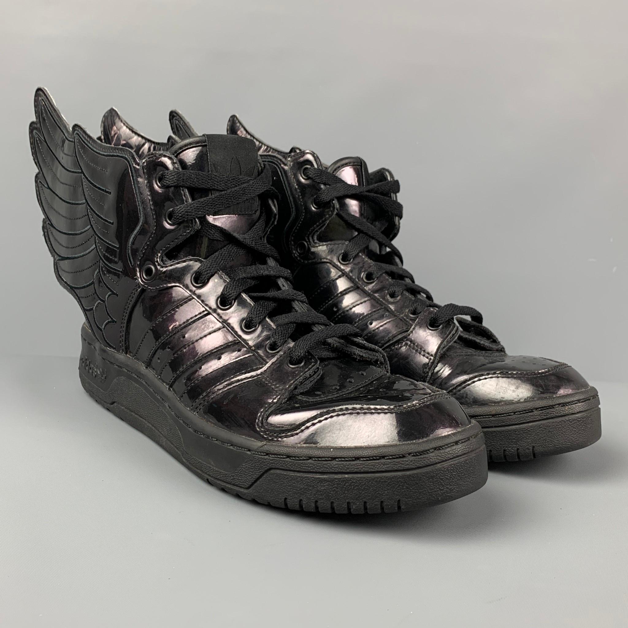 JEREMY SCOTT x ADIDAS sneakers comes in black patent leather featuring a wing design, rubber sole, and a lace up closure. 

Very Good Pre-Owned Condition.
Marked: 9

Outsole: 11.5 in. x 4 in. 