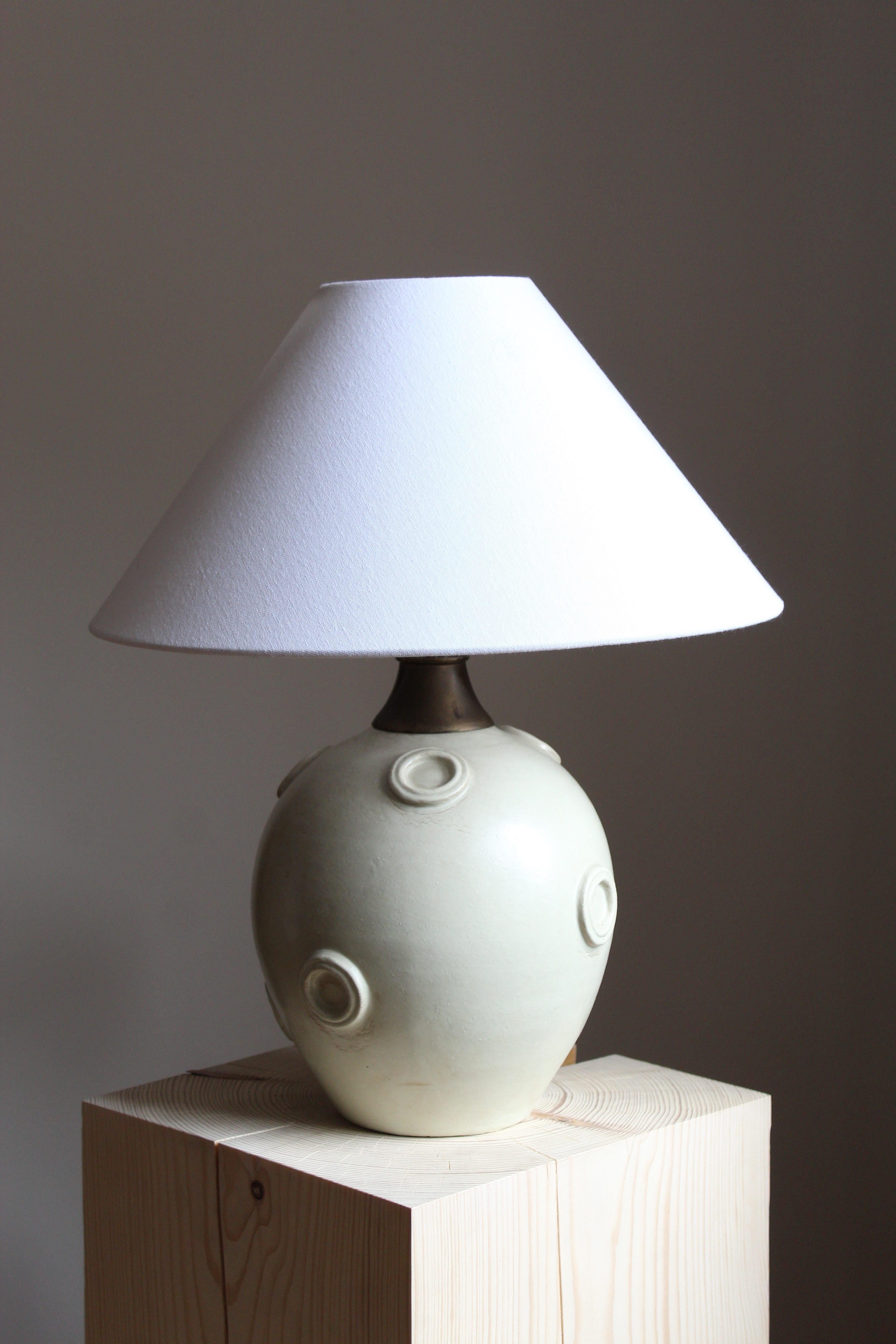 A large modernist table lamp designed by Jerk Werkmäster. Produced by Nittsjö, Sweden, 1930s. Stamped.

Sold without lampshade. Stated dimensions exclude the lampshade.

Glaze features a white-grey color.

Other designers of the period include Axel