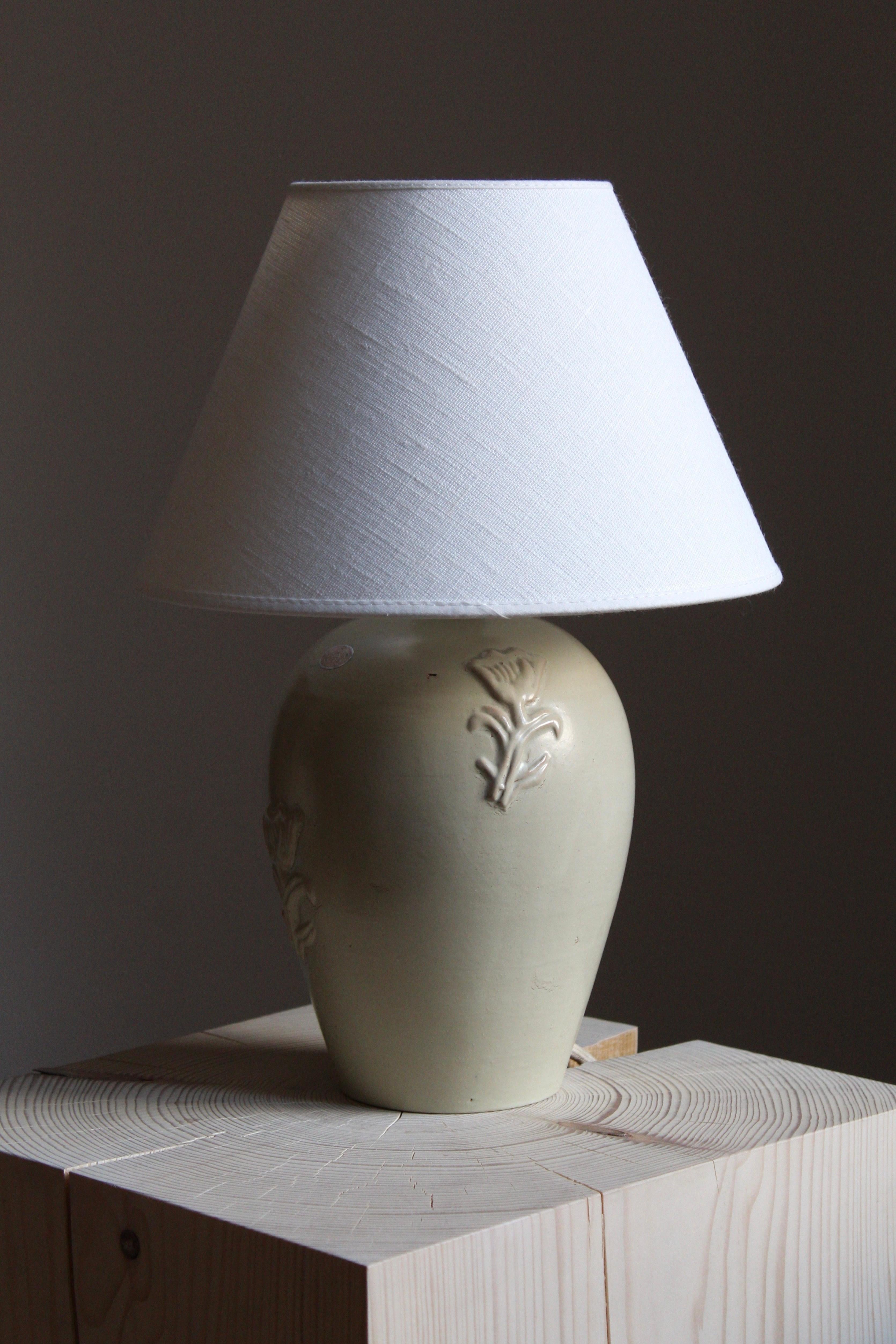 A table lamp designed by Jerk Werkmäster. Produced by Nittsjö, Sweden, 1950s. Stamped. Lampshade not included.

Glaze features a beige-grey color.

Other designers of the period include Axel Salto, Paavo Tynell, Lisa Johansson-Pape, Carl-Harry