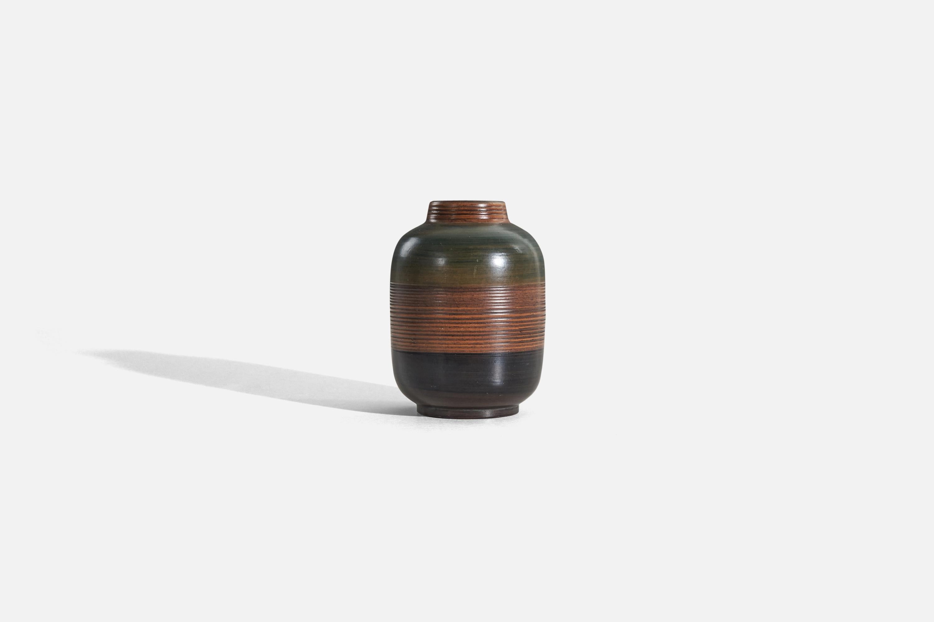 A brown, glazed earthenware vase designed by Jerk Werkmäster and produced by Nittsjö, Sweden, c. 1940s.