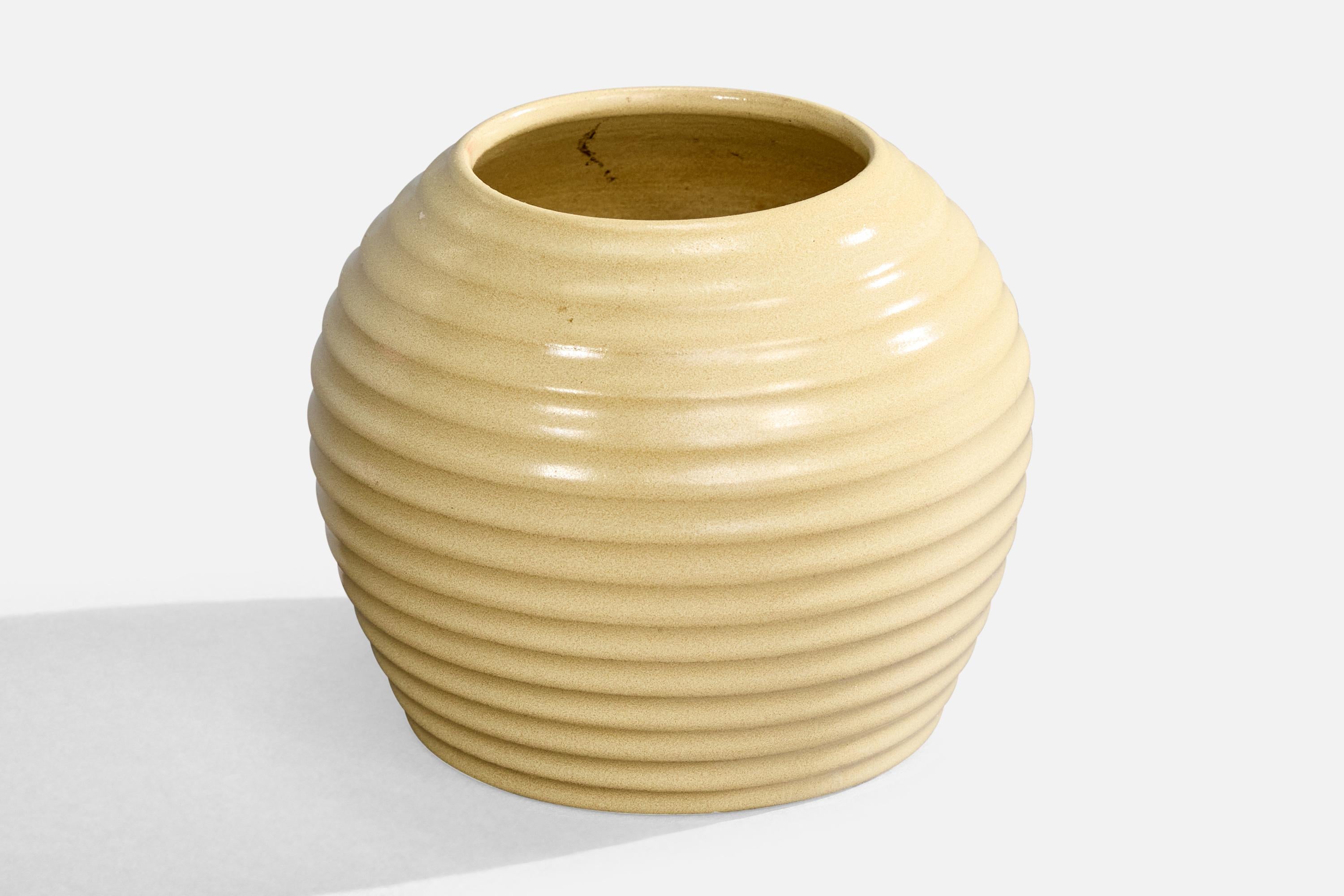 An incised yellow-glazed vase designed by Jerk Werkmäster and produced by Nittsjö, Sweden, c.1930s.

Overall Dimensions (inches): 3.75