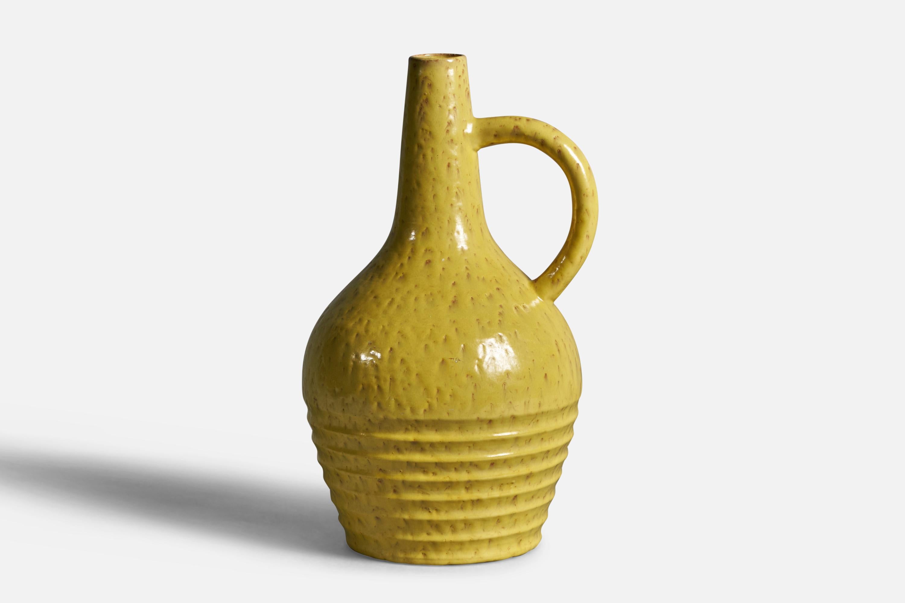 An incised yellow-glazed earthenware vase designed by Jerk Werkmäster and produced by Nittsjö, Sweden, 1930s.