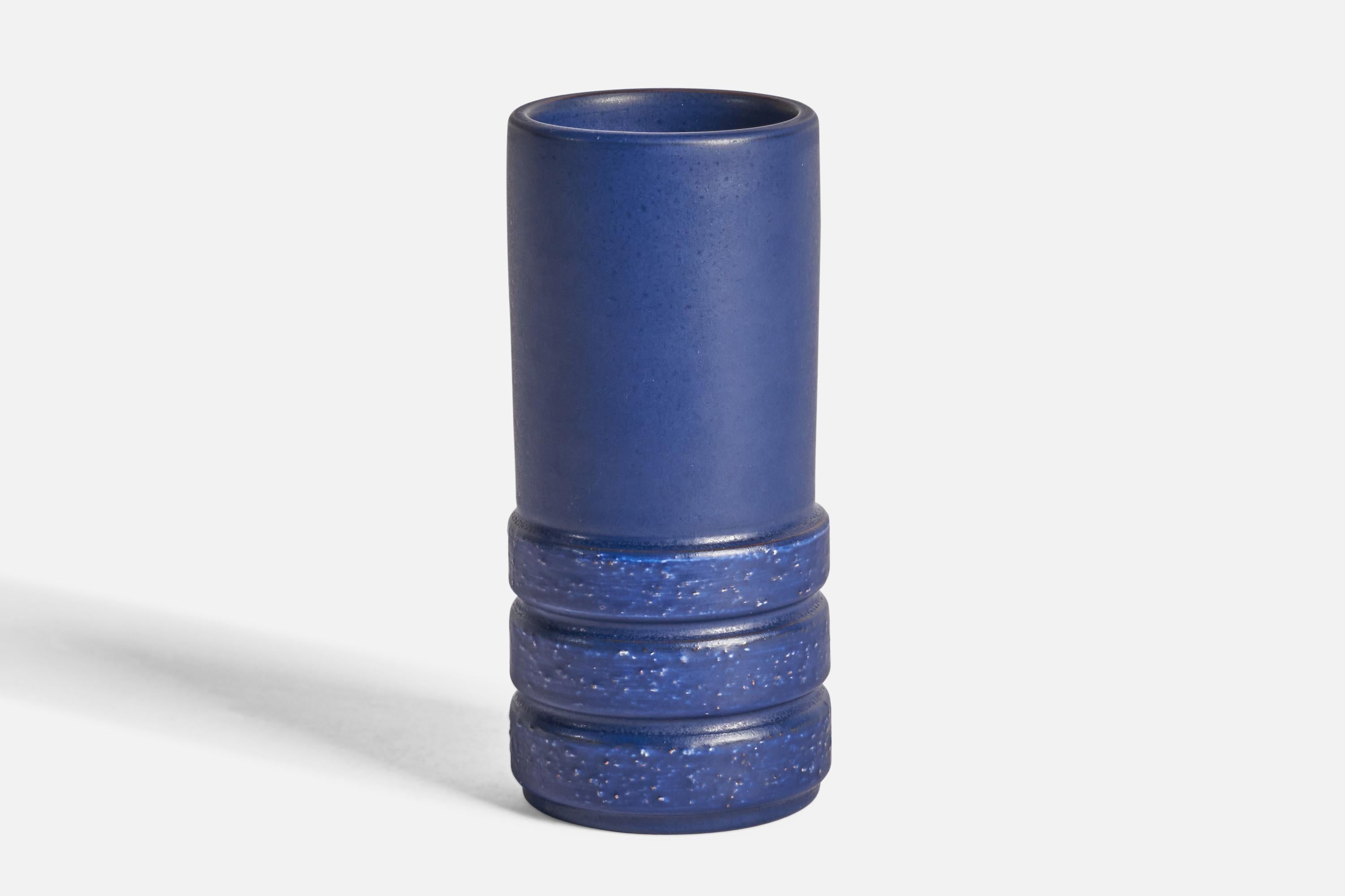 A blue-glazed earthenware vase designed by Jerk Werkmäster and produced by Nittsjö, Sweden, c. 1930s.

“NITTSJÖ HAND MADE IN SWEDEN” on bottom