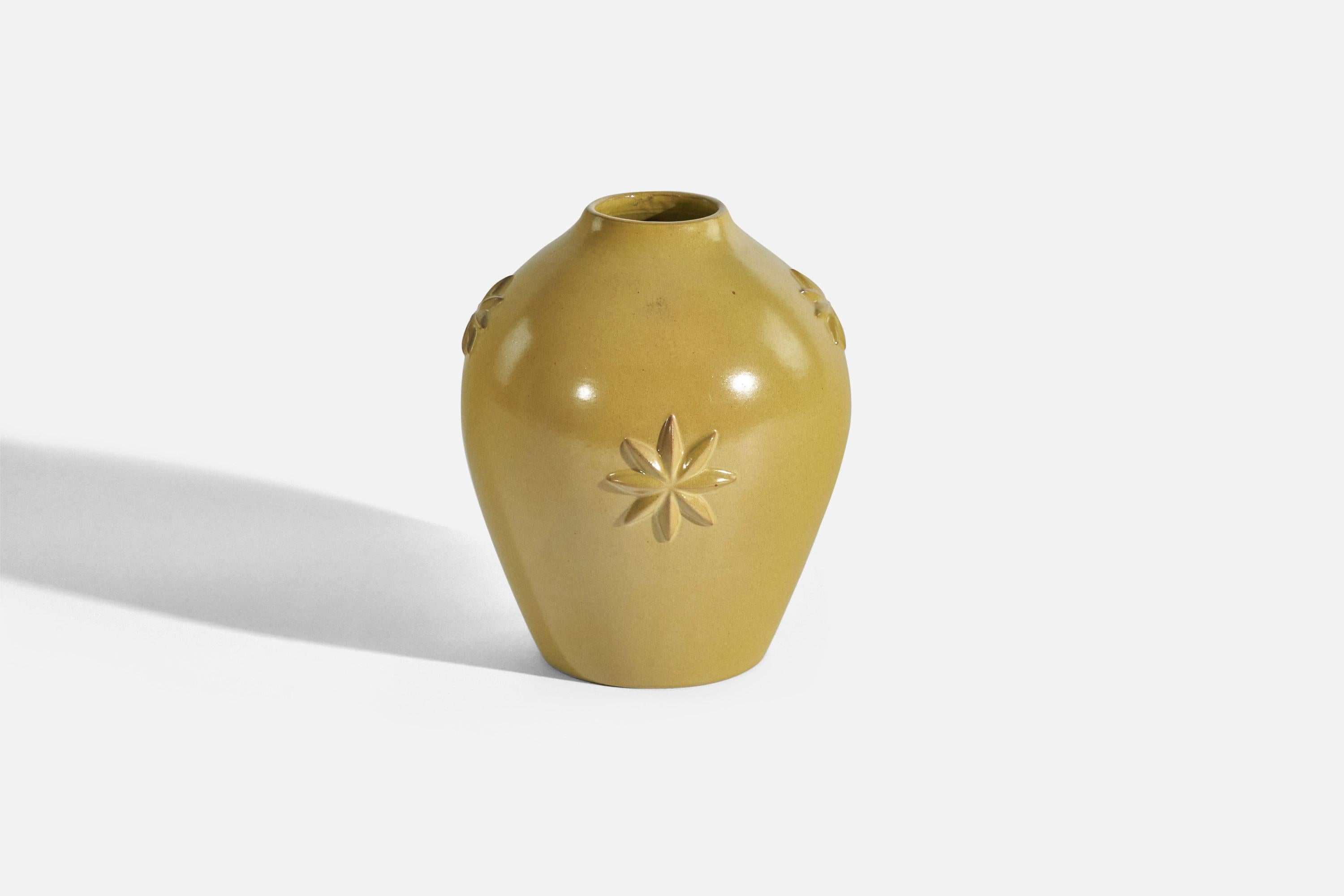 A yellow-glazed earthenware vase designed by Jerk Werkmäster and produced by Nittsjö, Sweden, 1940s. 


