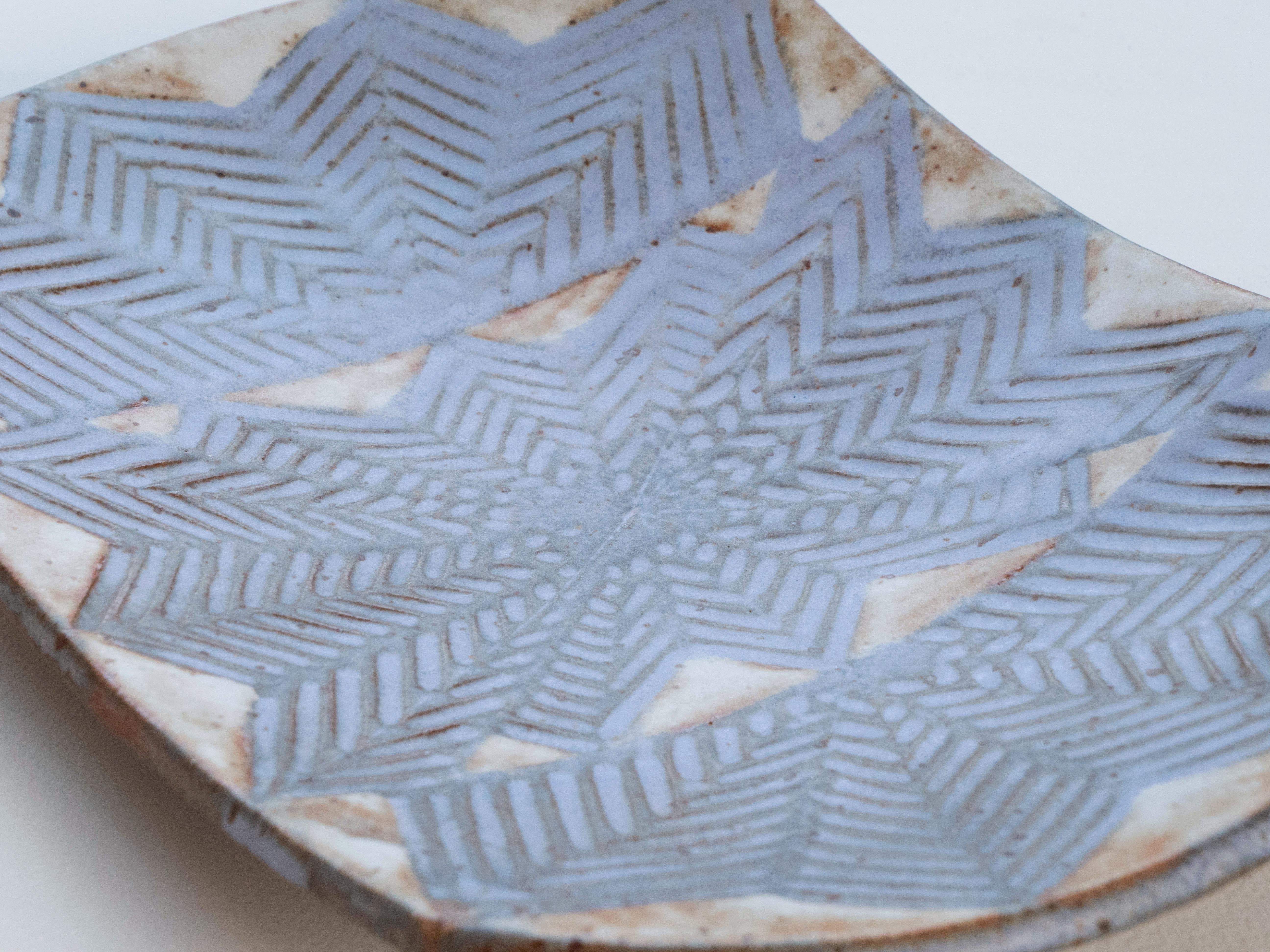 Purchased directly from Jerome & Evelyn Ackerman's personal studio at their former home in Culver City, California. This dish was hand thrown and features a very beautiful geometric pattern. It is excellent condition with no damage to note. Signed