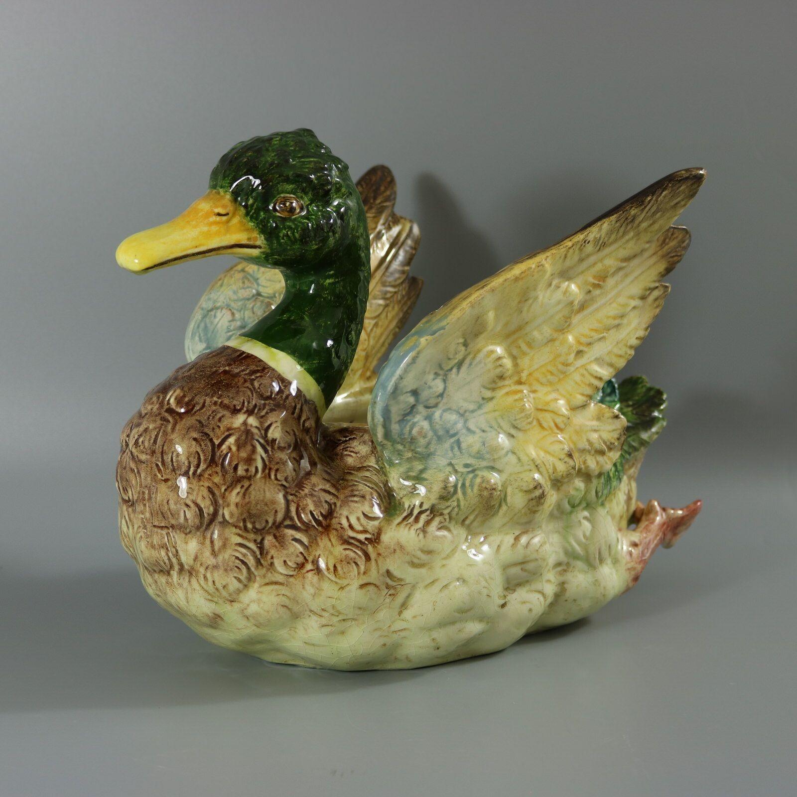 Jerome Massier French Majolica jardinière which features a mallard duck, in swimming position, with wings outstretched. Colouration: cream, green, brown, are predominant. The piece bears maker's marks for the Jerome Massier pottery. Book reference