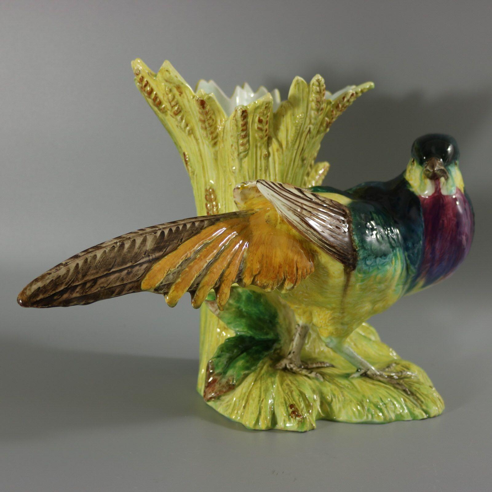 Jerome Massier Fils Majolica figural vase which features a colourful pheasant stood in front of corn/wheat. Colouration: green, purple, teal blue are predominant. The piece bears maker's marks for the Jerome Massier Fils pottery. Book reference