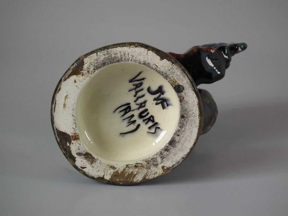 Jerome Massier Majolica vase which features a cockerel/rooster. Coloration: Ochre, pink, brown, are predominant. The piece bears maker's marks for the Jerome Massier pottery.