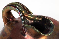 Jerome Massier: rara brocca in Massier Art Pottery con motivo iridescente a pigna e serpente