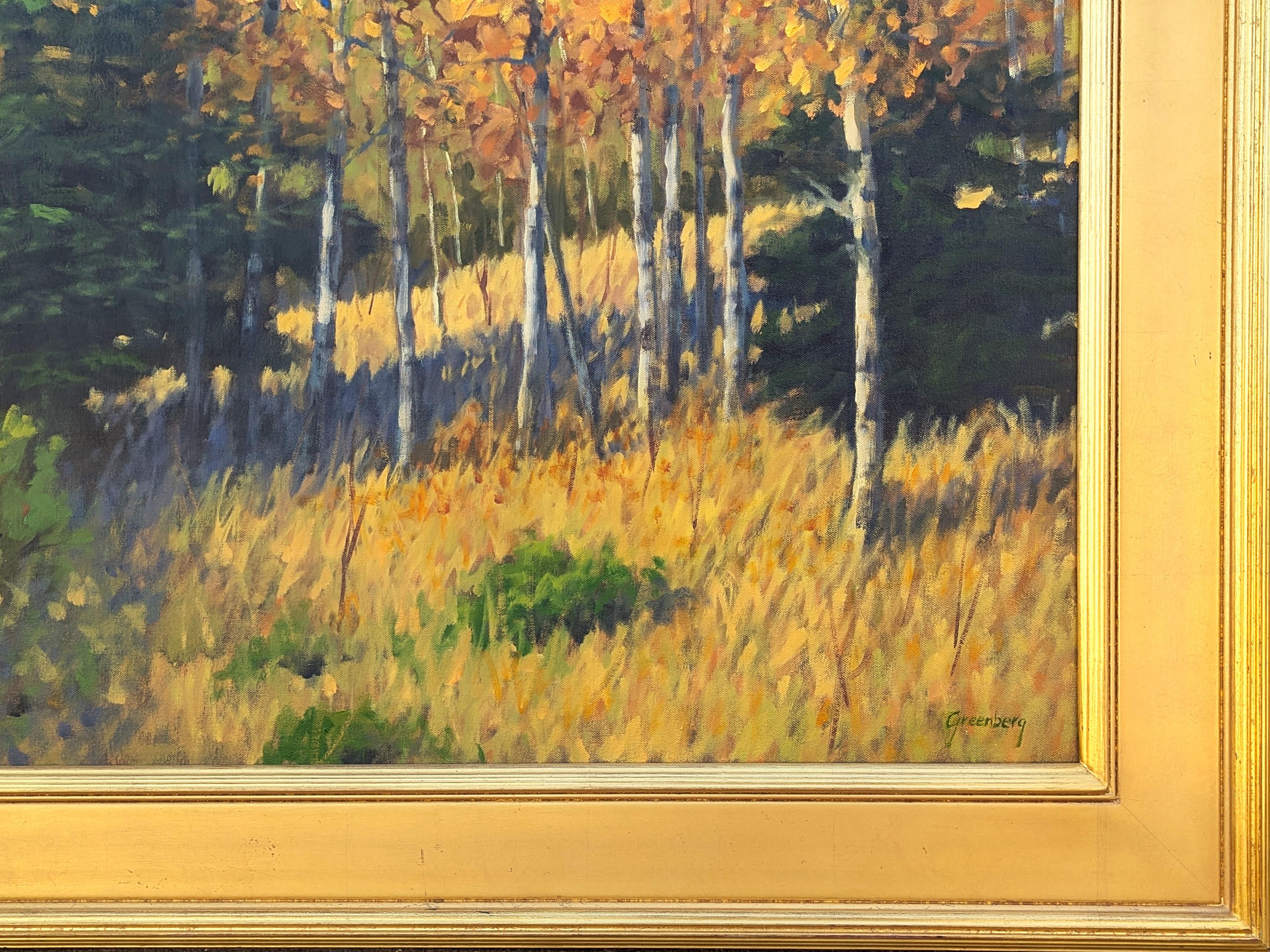 Quadro naturalistico realistico contemporaneo di paesaggio del Nuovo Messico dell'artista Jerry Greenberg di Houston. L'opera presenta una serie di alberi gialli e verdi su un cielo blu intenso. Firmato nell'angolo anteriore in basso a destra e