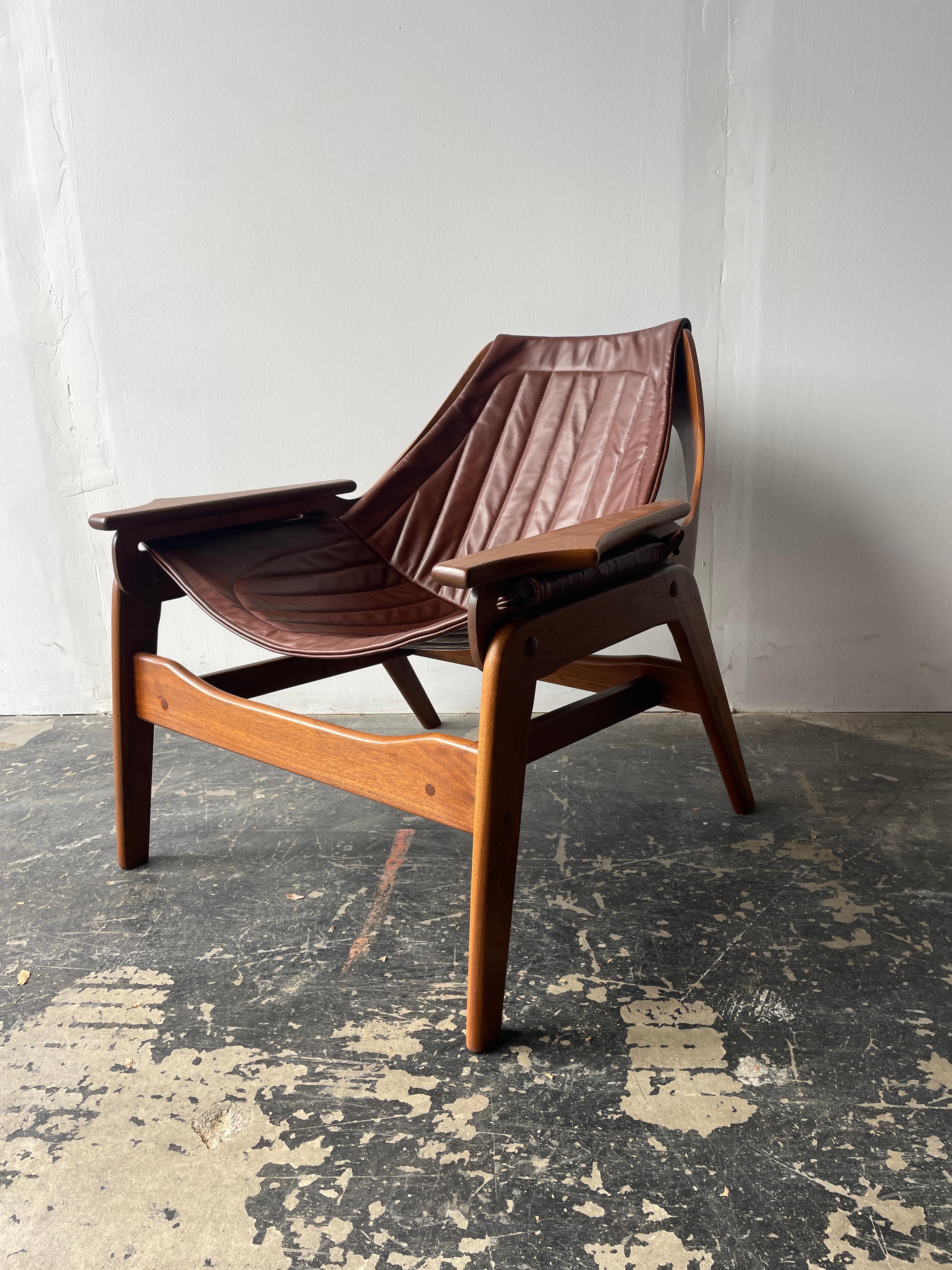 This is lounge chair designed and made by Los Angelican, Jerry Johnson is  cool Californian design at its best.  This leather sling chair was patented by Johnson in 1964. This is an extremely comfortable chair and a special piece of Californian