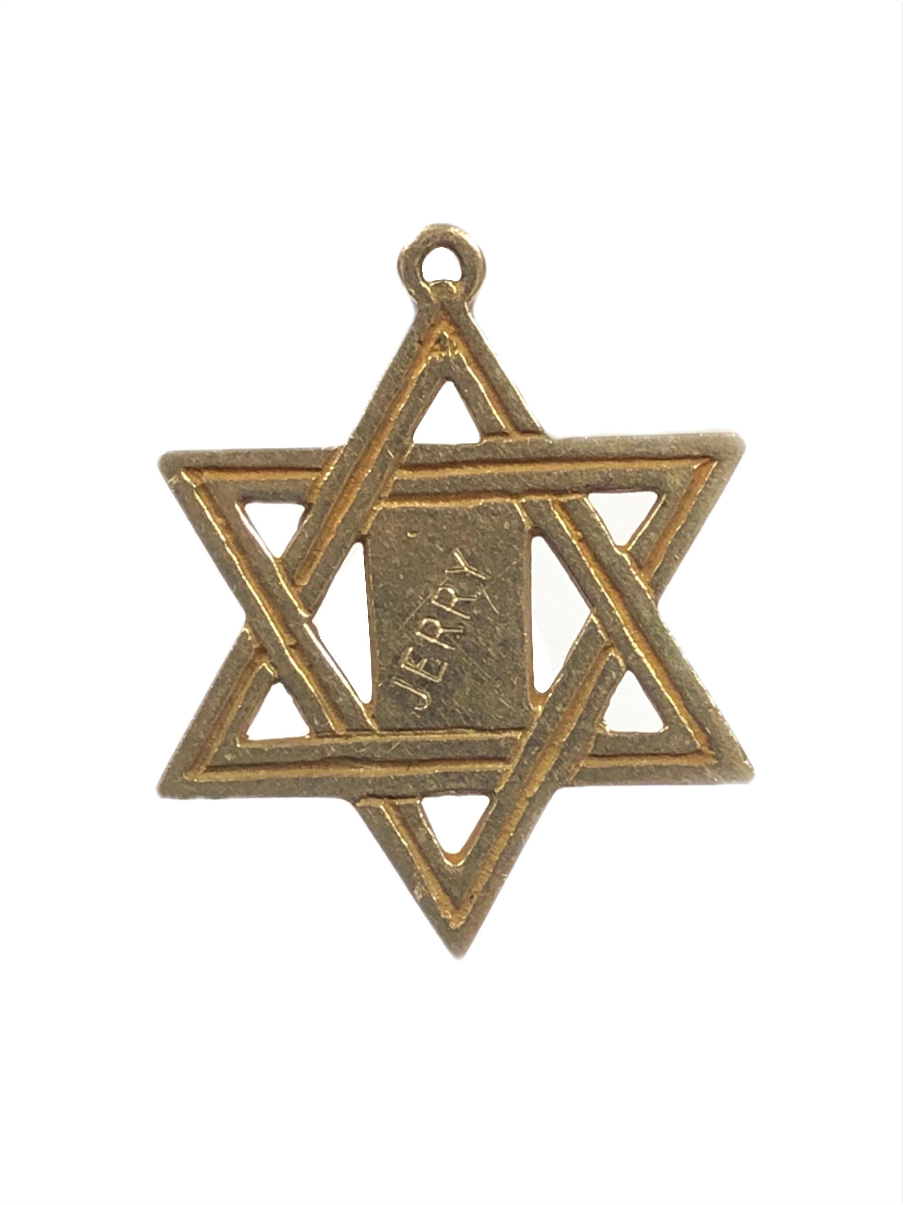 Owned and Worn by Hollywood Icon Jerry Lewis is this Circa 1960s 14K Yellow Gold Star of David with Ten Commandments center pendant, measuring 1 1/4 x 1 inch.  The reverse side of the piece is engraved 