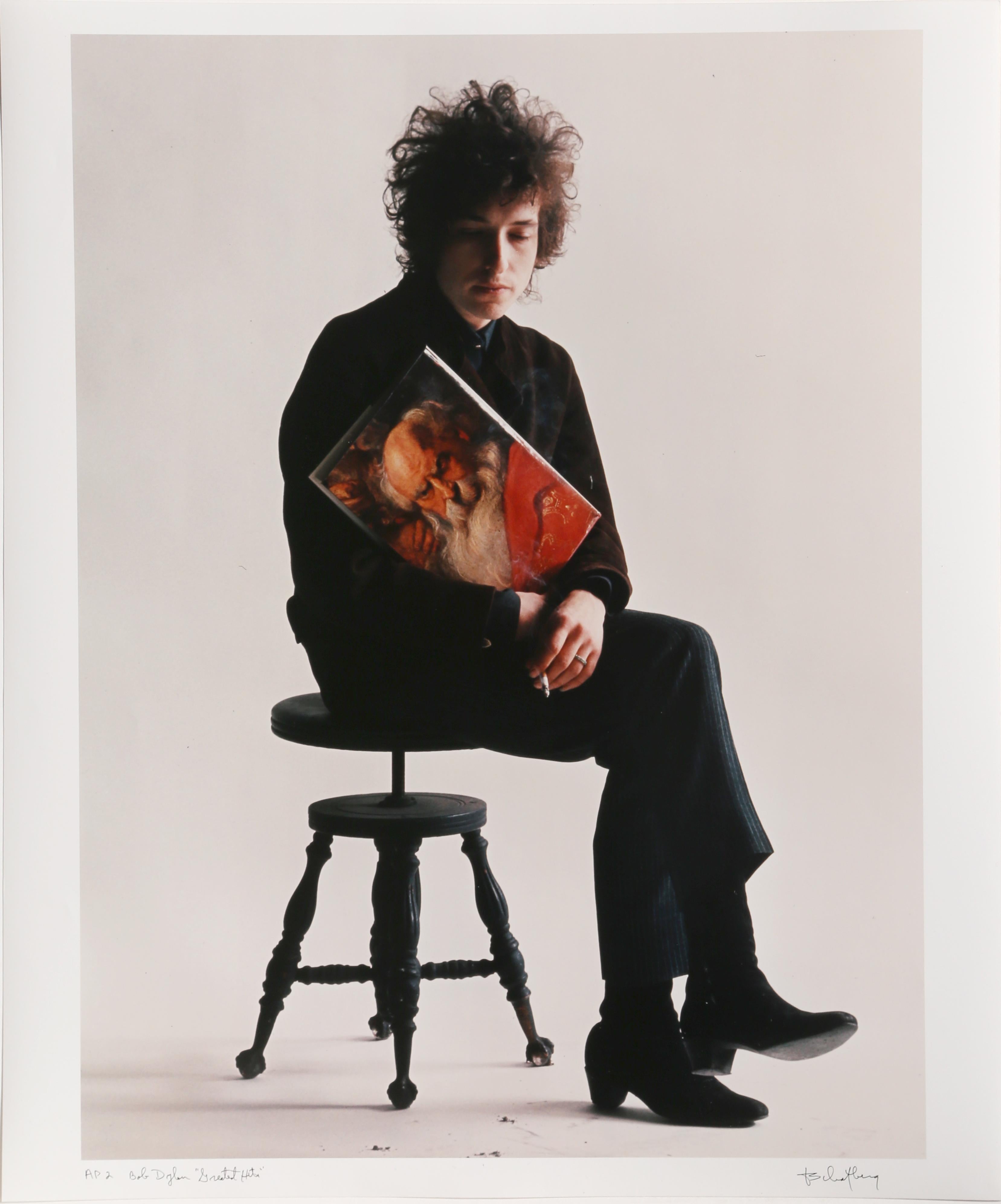 Artist: Jerry Schatzberg, American (1927 - )
Title: Bob Dylan "Greatest Hits"
Year: 1965, printed later
Medium: Color Photograph, signed and numbered in ink
Edition: AP 2 
Size: 24 in. x 20 in. (60.96 cm x 50.8 cm)