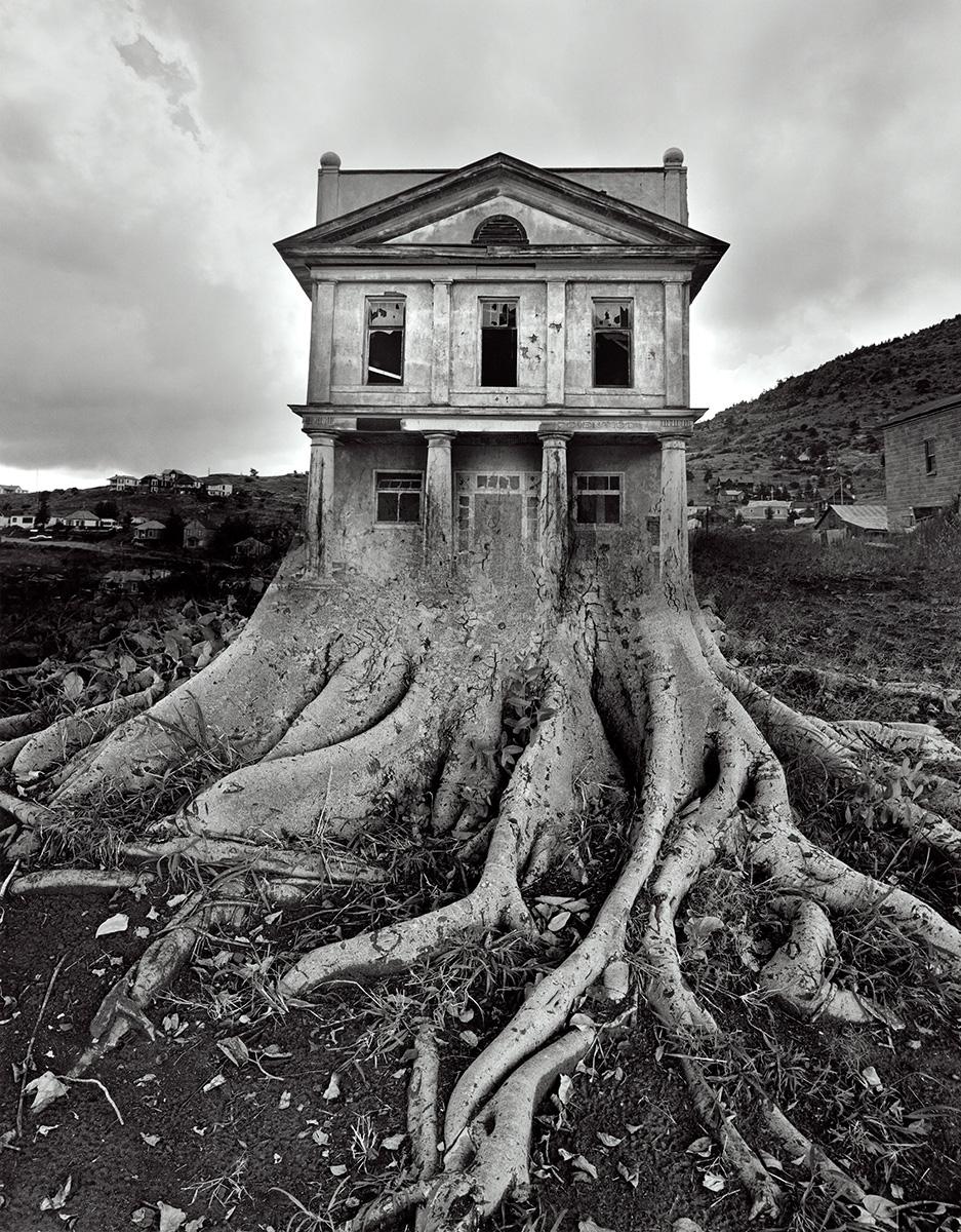 Jerry Uelsmann. Untitled, 1982, silver gelatin print. Signed, 'untitled' and dated on print verso. Signed on matt recto and mount verso. Image Size; 19 x 15", [surreal tree and house]
