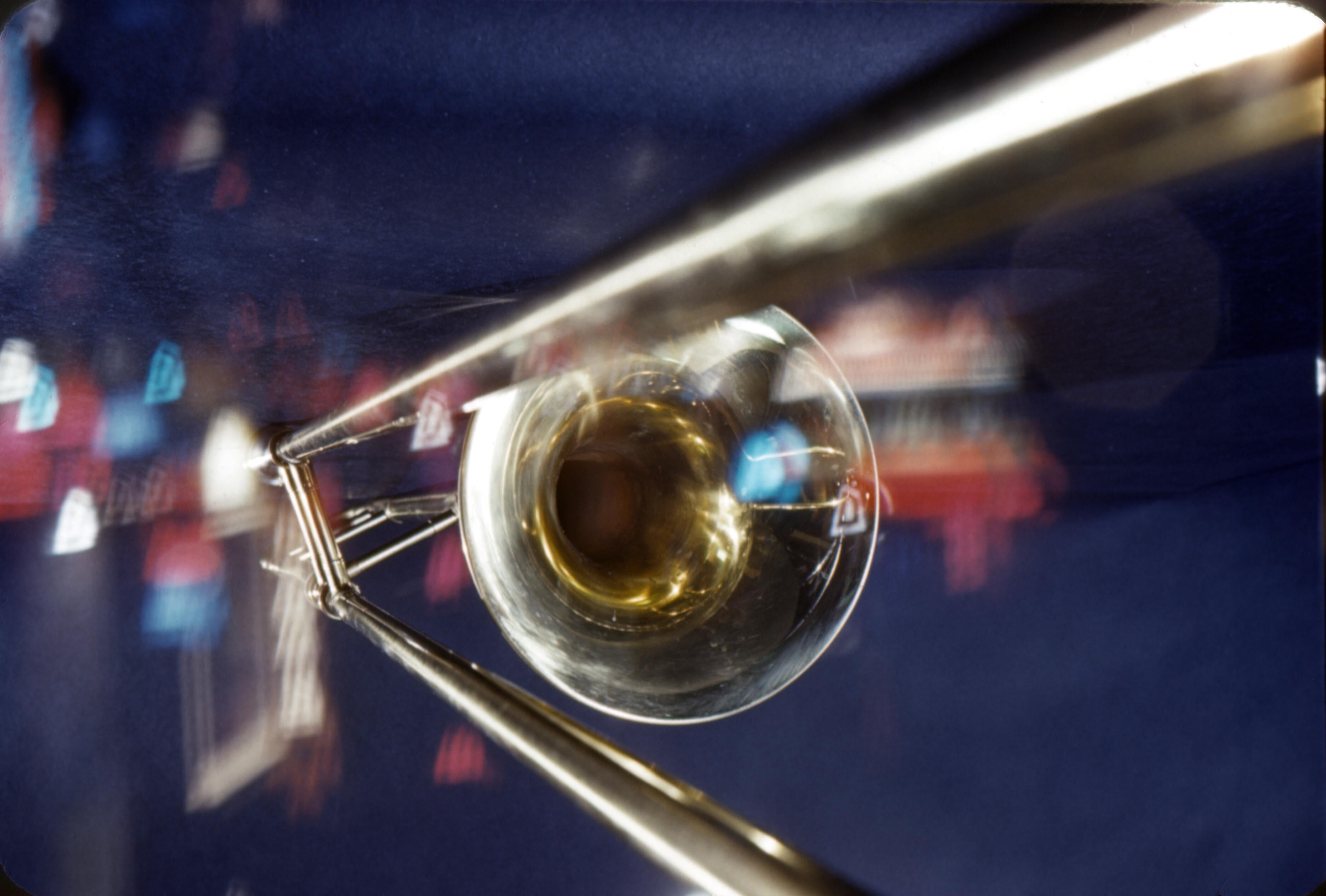 Jerry Yulsman Color Photograph - Abstract Trombone in Window Fine Art Print