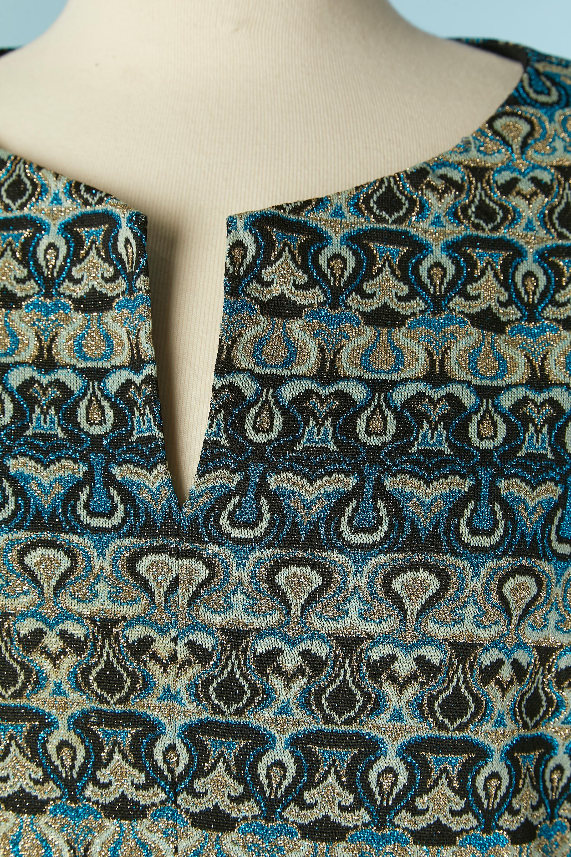 Jersey lurex jacquard cocktail dress. No fabric composition tag. Lining probably acetate. 
Zip and hook&eye closure in the middle back. Split in the middle front bottom, lenght = 27 cm 
SIZE 40 (Fr) L 