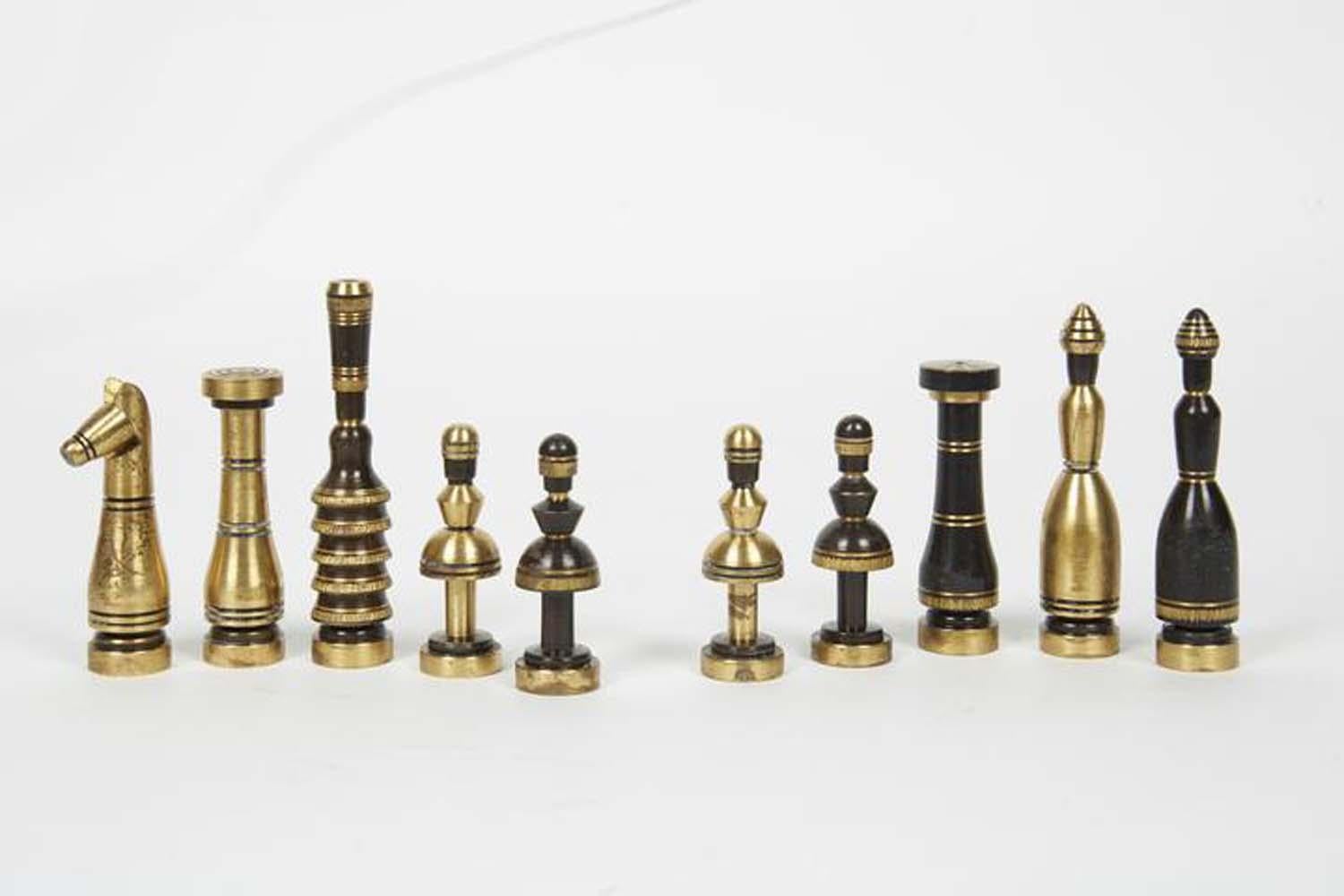 Chess set by Hans Teppich, Jerusalem, Israel, circa 1960.
32 pieces, cast brass and engraved, with Teppich characteristic design, placed in original wooden box with etched decorations.

Hans Teppich was born in Germany in 1904. After finishing