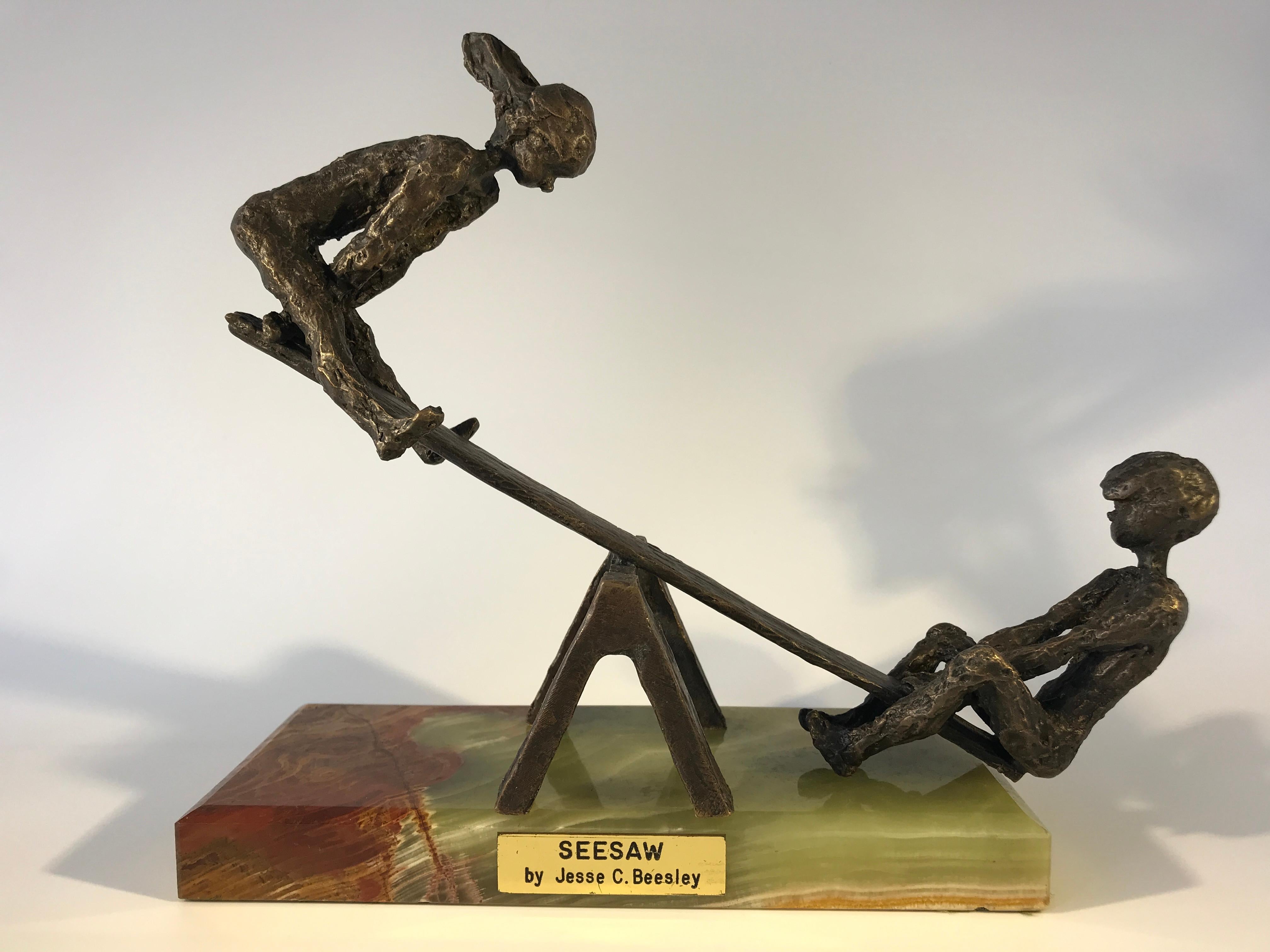 Bronze sculpture of young boy and girl on a SeeSaw by American sculptor Jesse C Beesley of Tennesee
Known for his bronze sculptures of children, his work is in private collections and also the Smithsonian Museum collection.
On titled plinth with