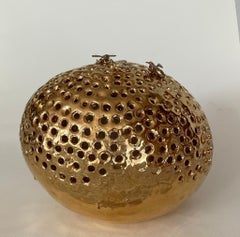 pure gold patina sculpture of a ceramic beehive, bronze bees