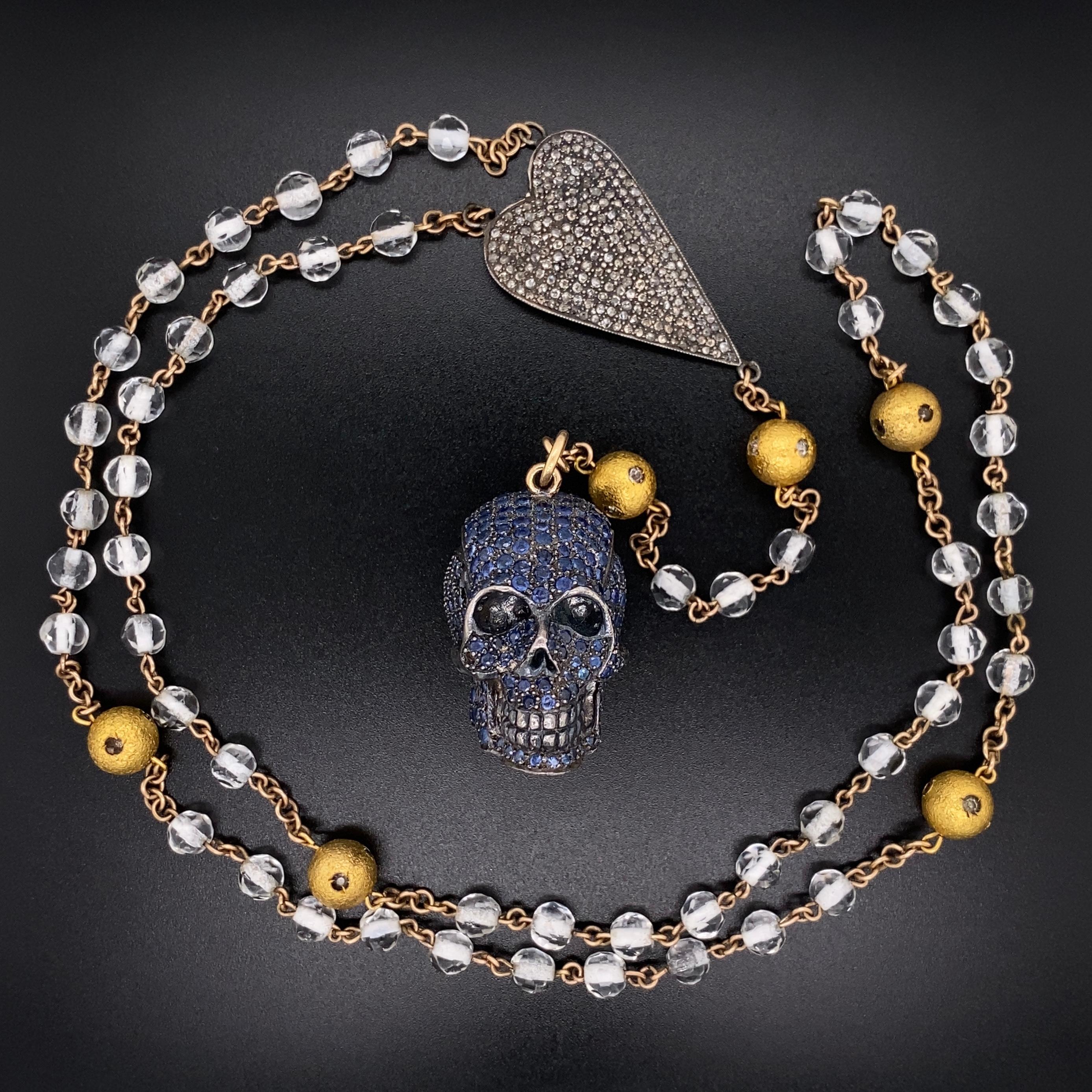 Simply Fabulous! Designer Signed Jessica Kagan Cushman Sapphire encrusted Skull and Diamond encrusted Heart on Crystal Bead and Sterling Silver 925 Chain Necklace. Approx. Sapphire weight: 7.5tcw and Diamonds, approx.  2.5tcw. Necklace measures