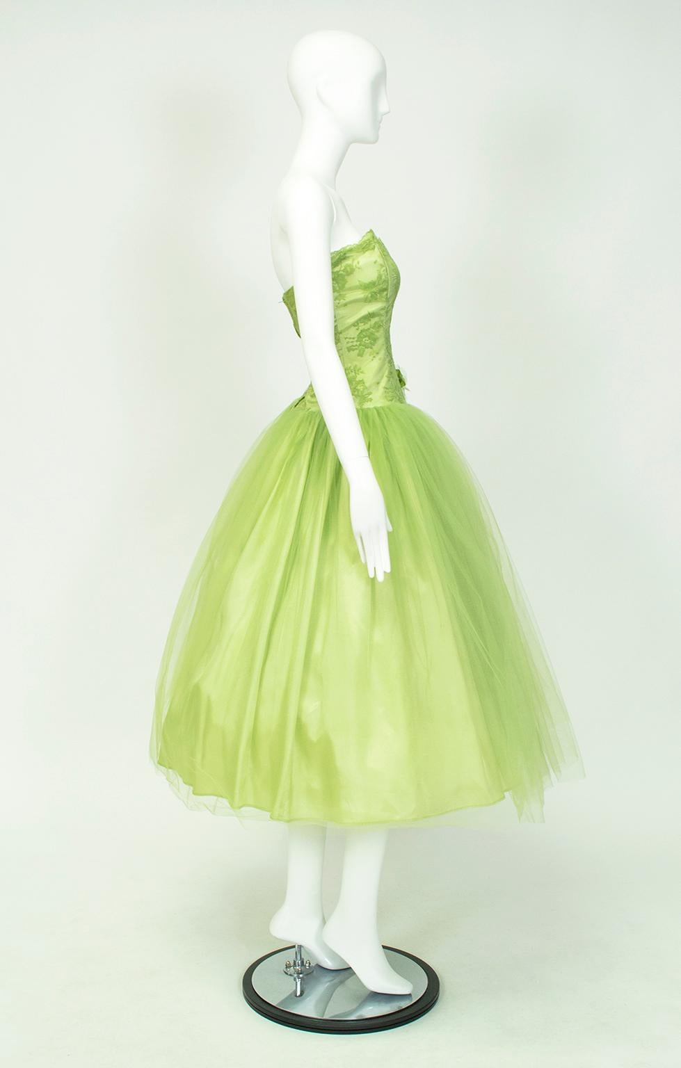 Ideally suited for a gal with a long waist, this zinger of a party dress “poufs” abruptly where the skirt meets the bodice for a dramatic tabletop skirt effect. Endless yards of tulle make the dress look like lime cotton candy.

Strapless prom dress