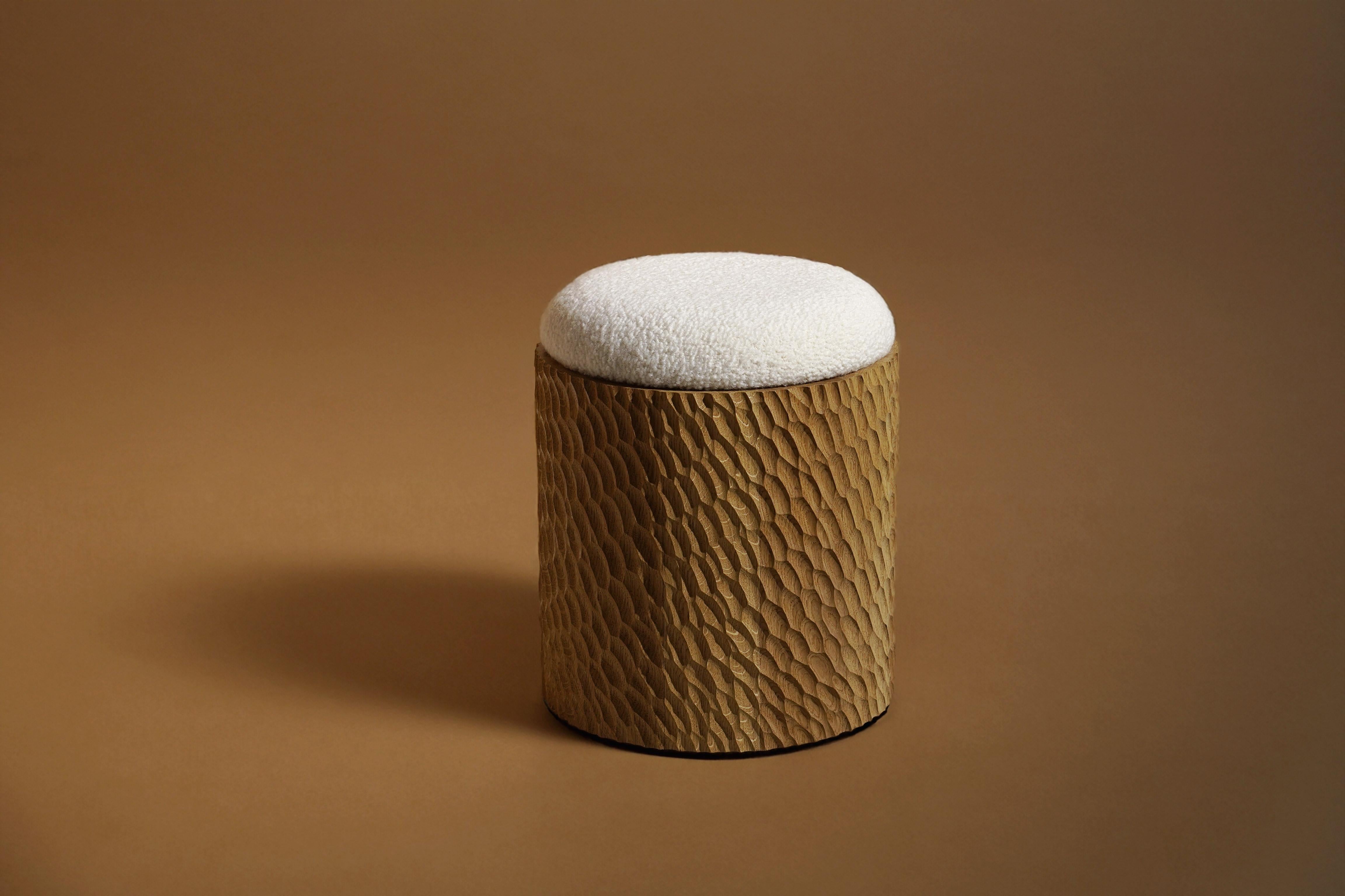 Jessie Stool by Proisy Studio.

Jessie is an elegant and refined hand-carved stool designed by Proisy Studio. The handcrafted gouge carving work makes each piece unique that adds a touch of texture, vibrancy and visual excitement to any space. 
The