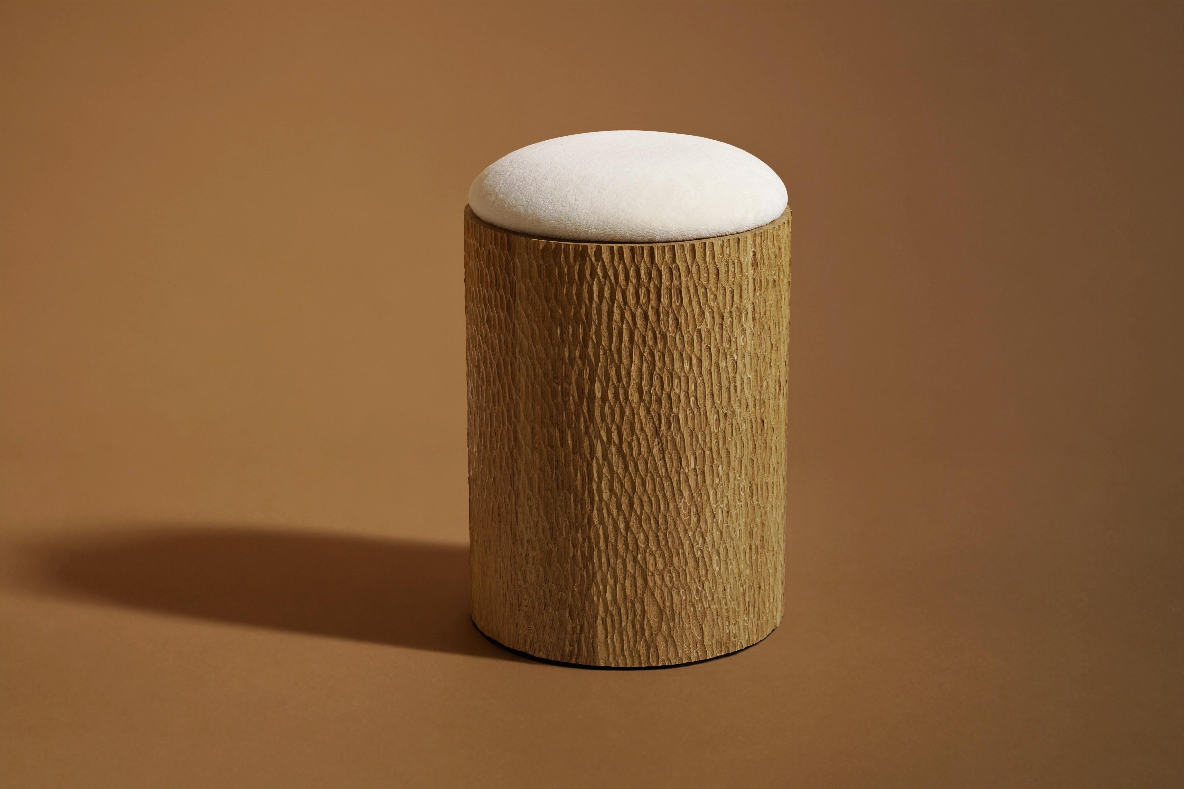 Jessie Stool by Proisy Studio.

Jessie is an elegant and refined hand-carved stool designed by Proisy Studio. The handcrafted gouge carving work makes each piece unique that adds a touch of texture, vibrancy and visual excitement to any space. 
The