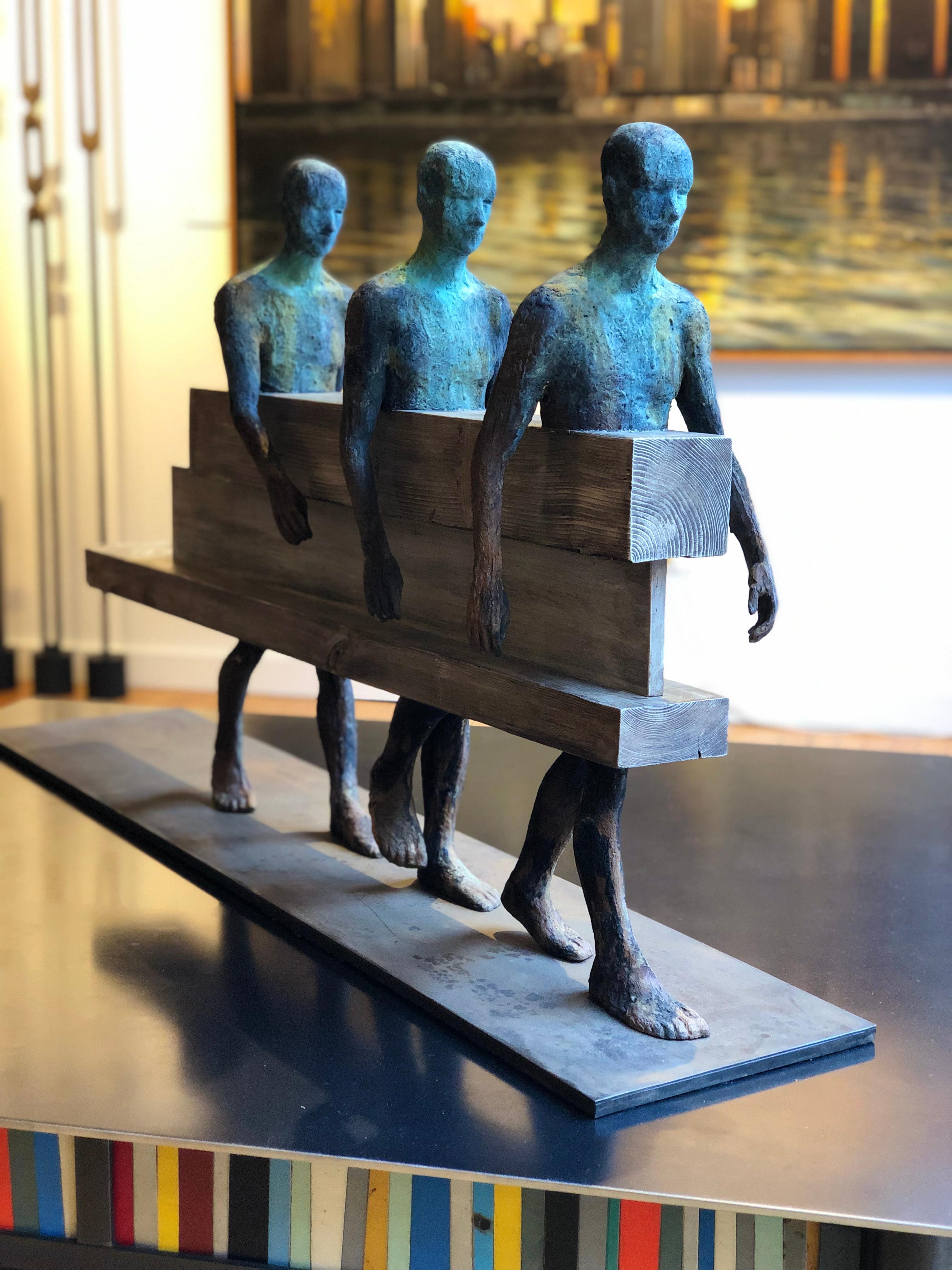 Caminantres - Bronze, Steel & Wood, Sculpture of Three Figures Walking in Tandem 1
